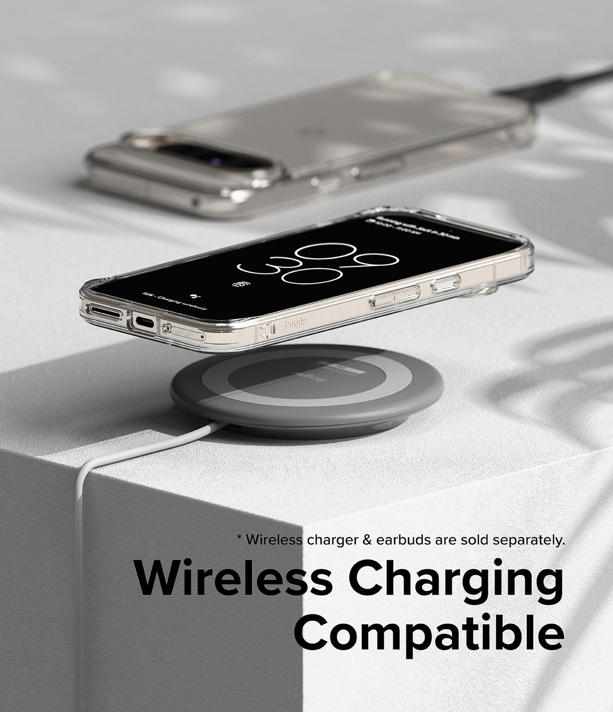 Google Pixel 9 Pro XL Case | Fusion - Clear phone case on a wireless charging pad with another phone in the background.