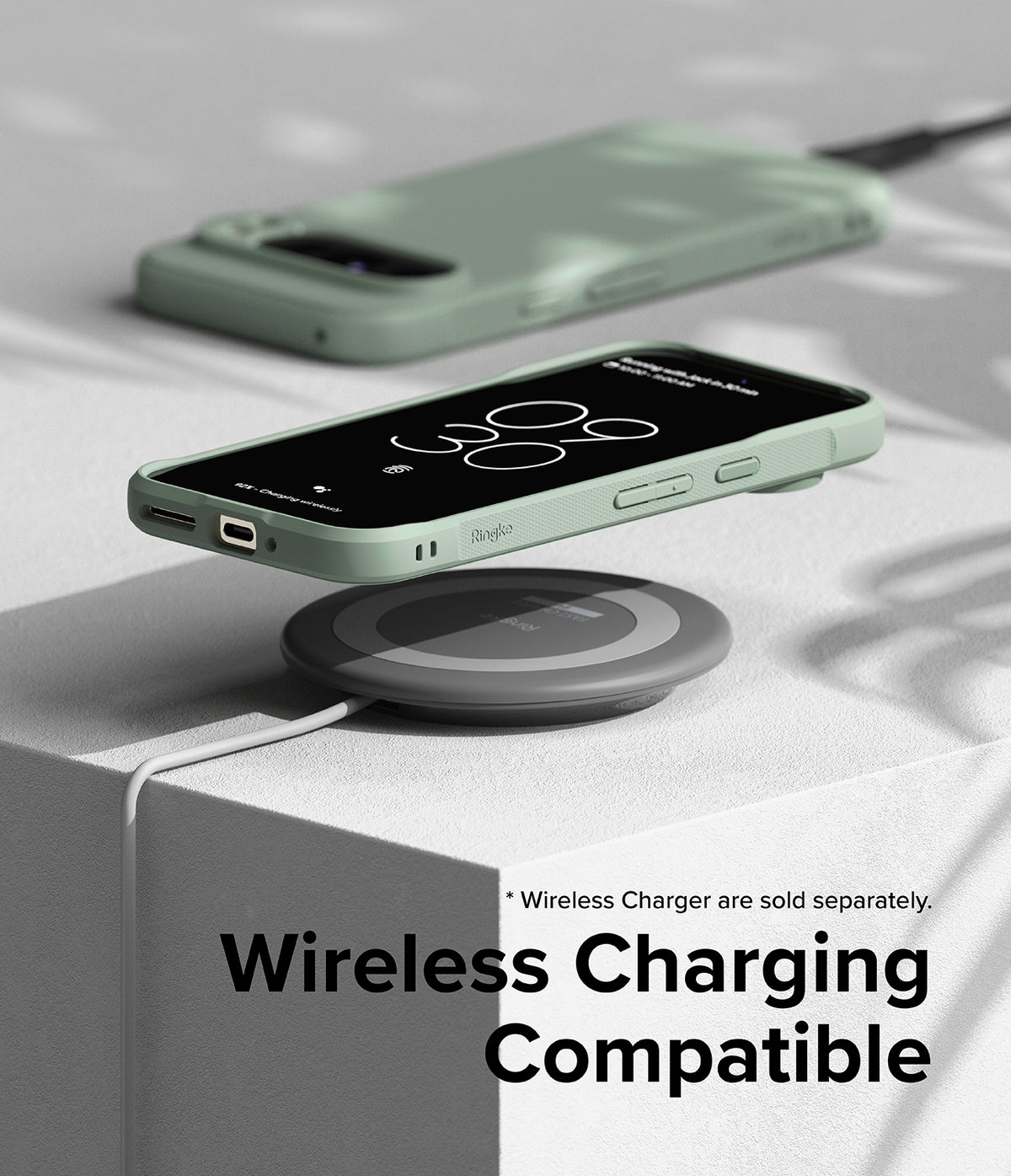 Google Pixel 9 Pro XL Case | Onyx - Sage green phone case on a wireless charging pad with a digital clock display.