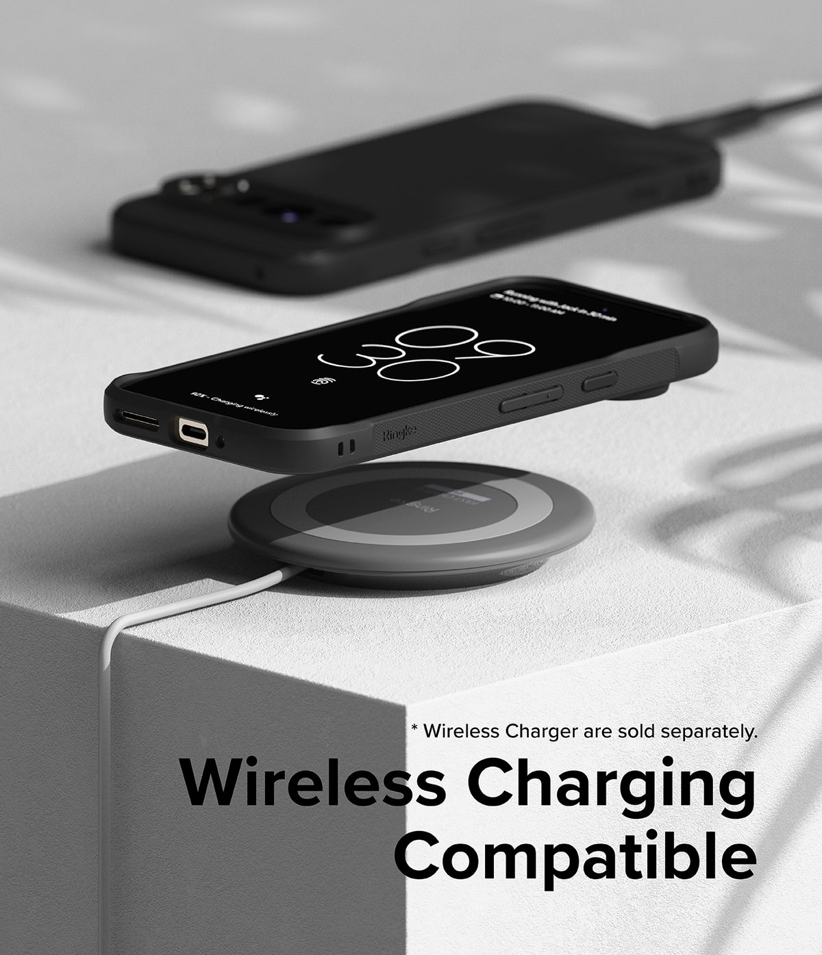 Google Pixel 9 Pro Case | Onyx - Black phone case on a wireless charging pad, demonstrating wireless charging compatibility.