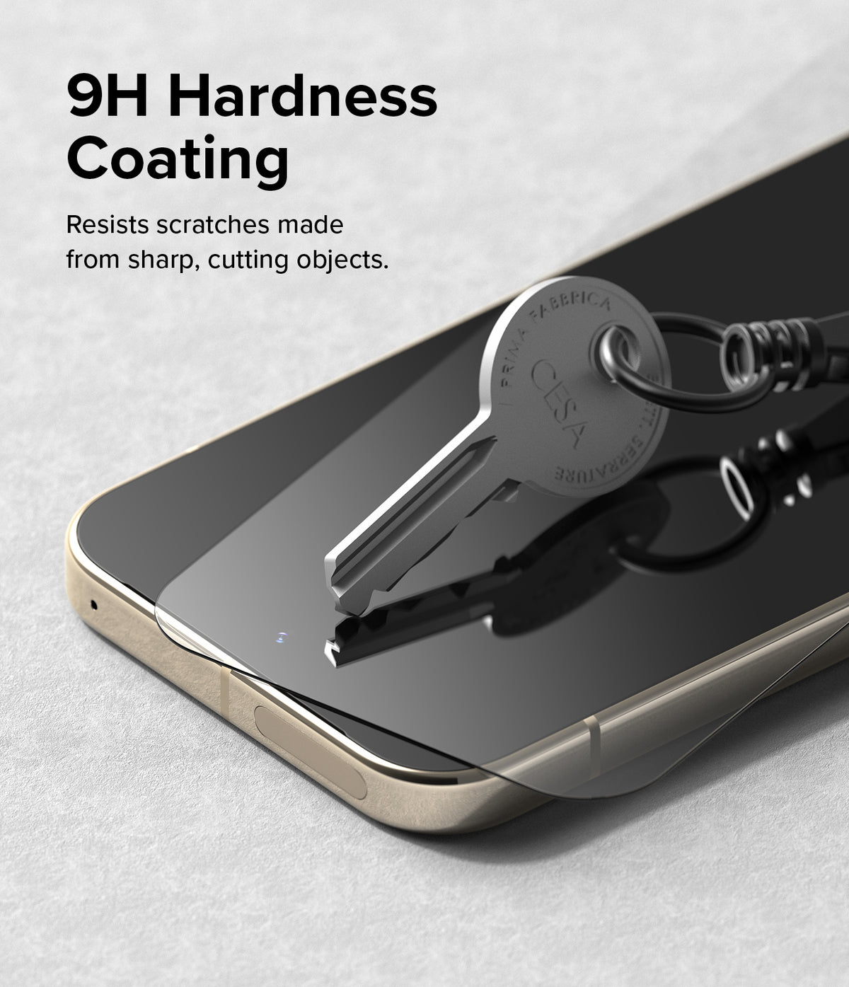 Google Pixel 9 Pro / 9 Screen Protector | Easy Slide Tempered Glass - Google Pixel 9 Pro / 9 Screen Protector - A metal key resting on a phone screen protector, demonstrating 9H hardness.