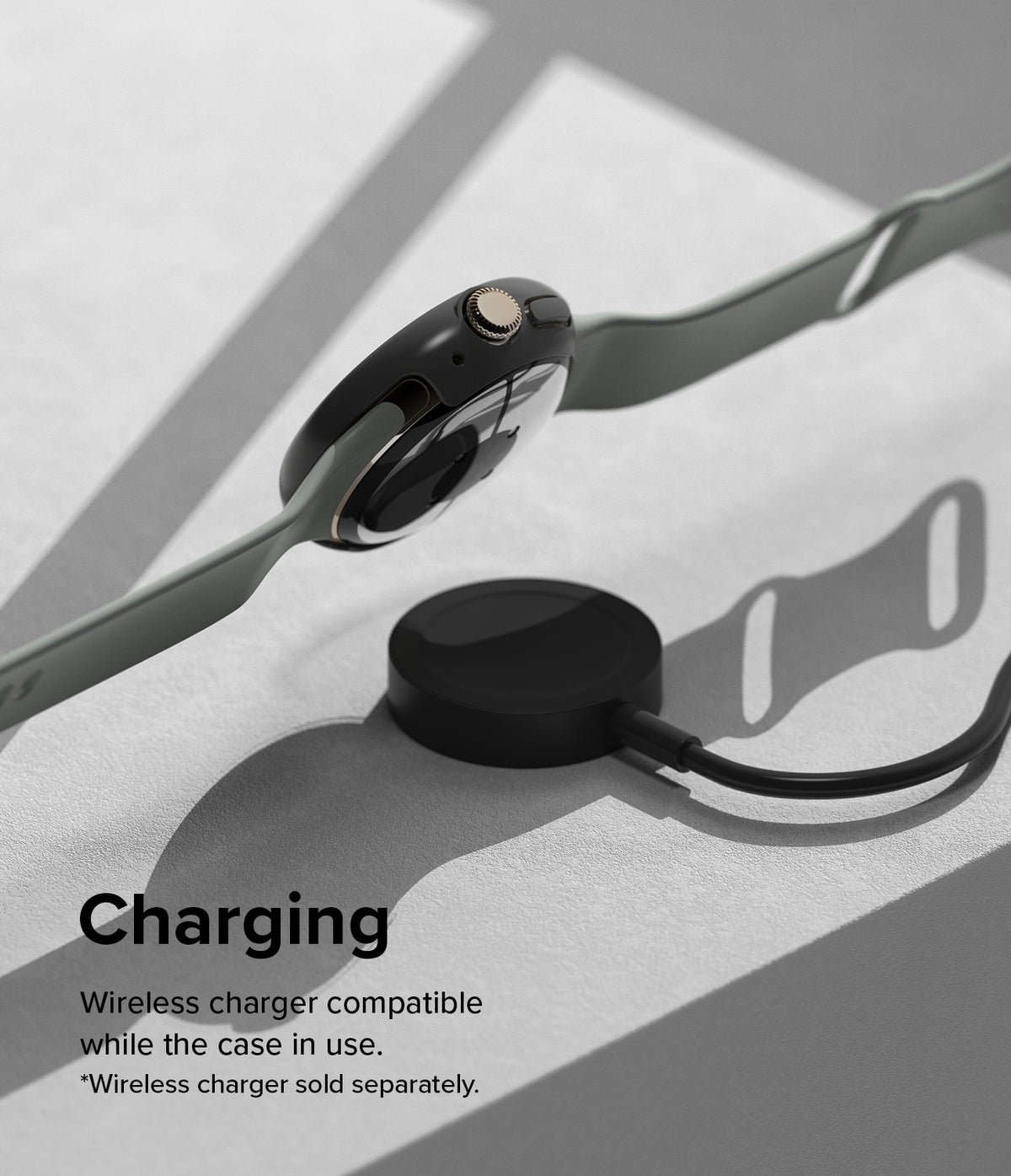 Google Pixel Watch 3 45mm | Slim - A black protective case on a smartwatch hovering above a wireless charging puck.