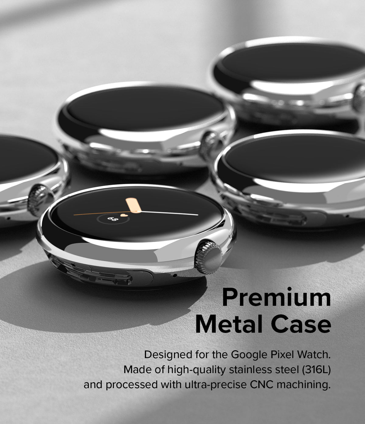 Google Pixel Watch 41mm | Bezel Styling - Multiple polished stainless steel watch bezels arranged on a grey surface.