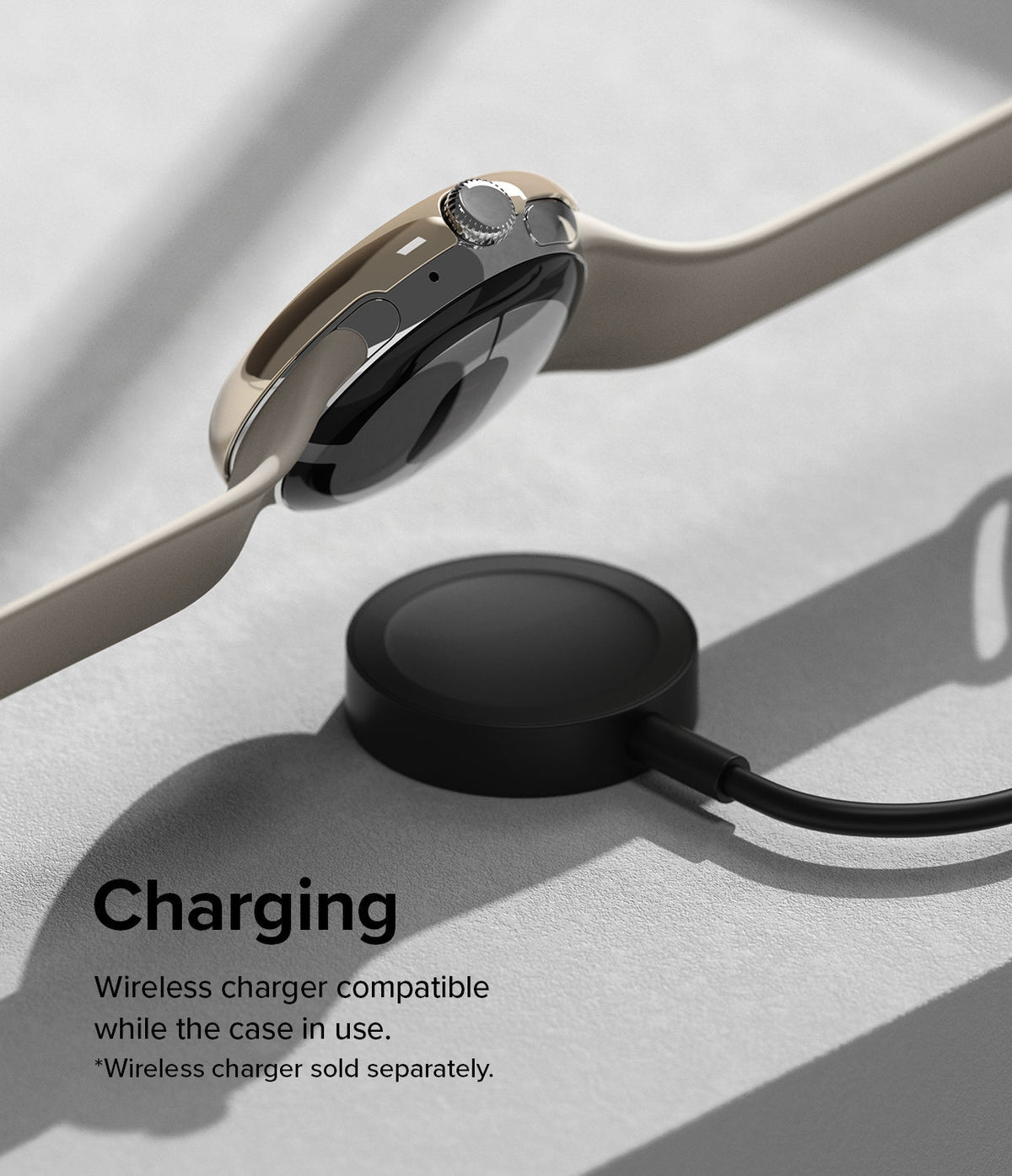 Google Pixel Watch 41mm | Bezel Styling - A gold-cased Pixel Watch hovering above a black wireless charging puck.