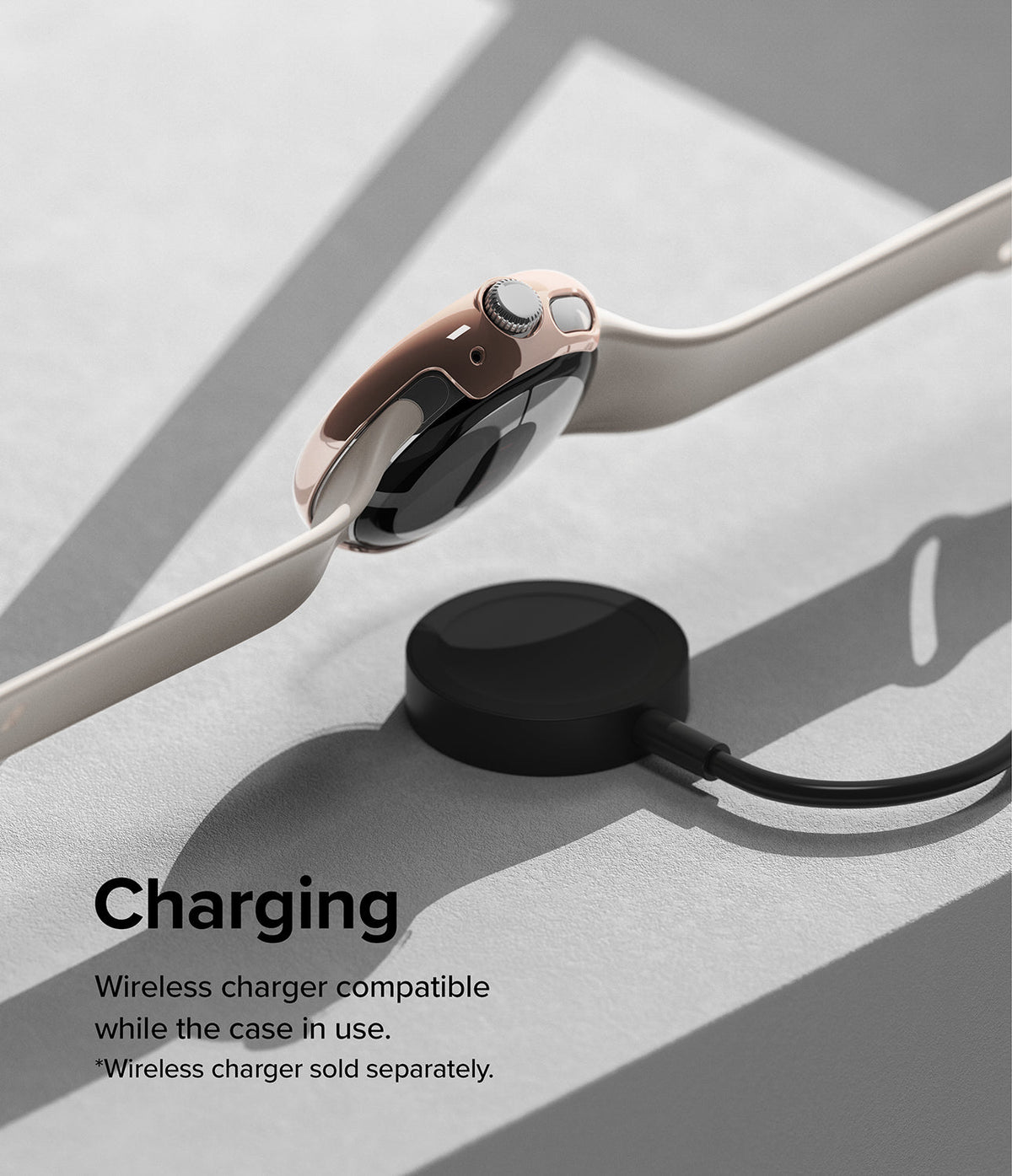Google Pixel Watch Case | Slim - Rose gold watch case on a Pixel Watch hovering above a black wireless charging puck.