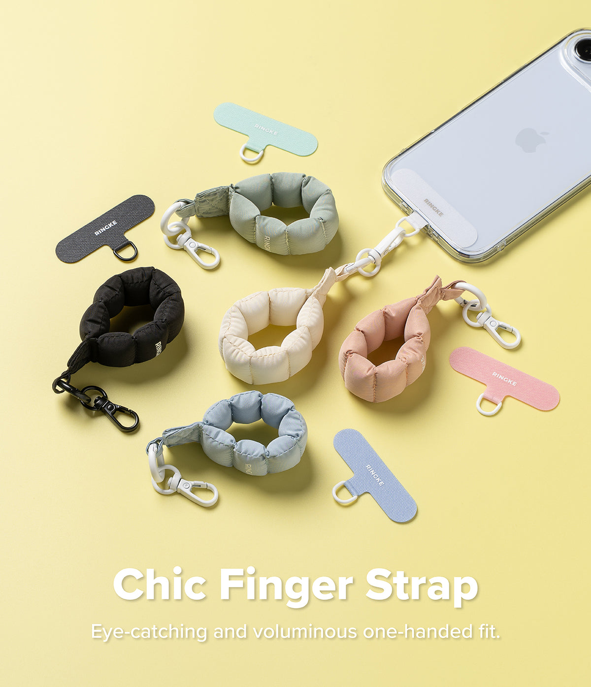 Holder Link Puffer | Finger - Colorful, puffy ring-shaped phone straps with clips and adhesive anchor tabs on a yellow background.