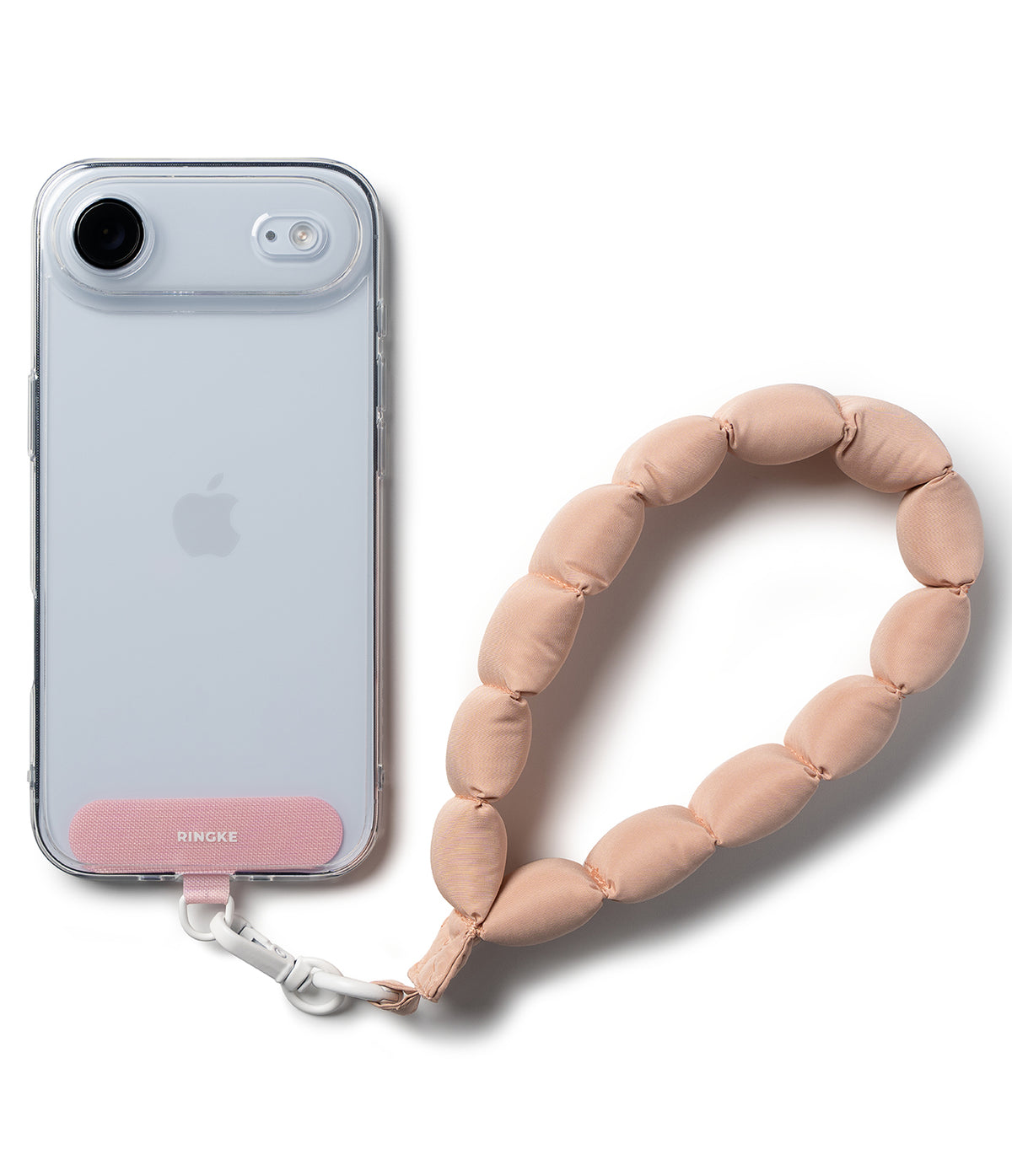 Holder Link Puffer | Hand - Clear phone case with a pink Ringke tab attached to a beige, quilted, puffer-style wrist strap.