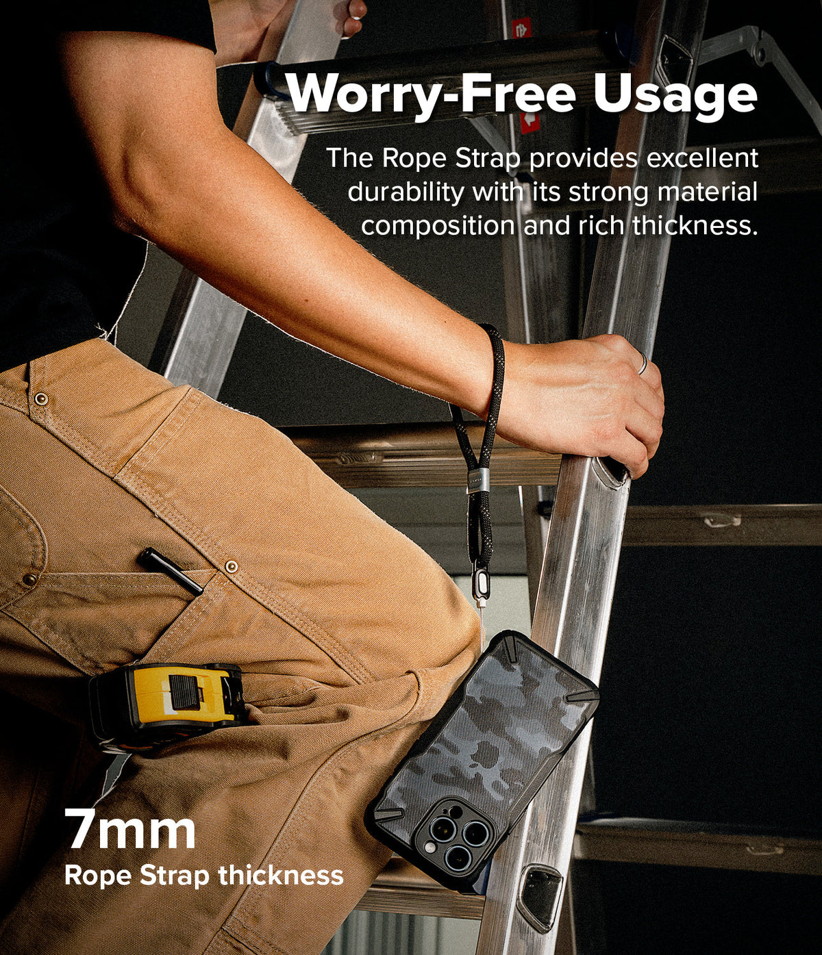 Rope Hand Strap - A person on a ladder holds a phone with a black rope wrist strap, highlighting its 7mm thickness.