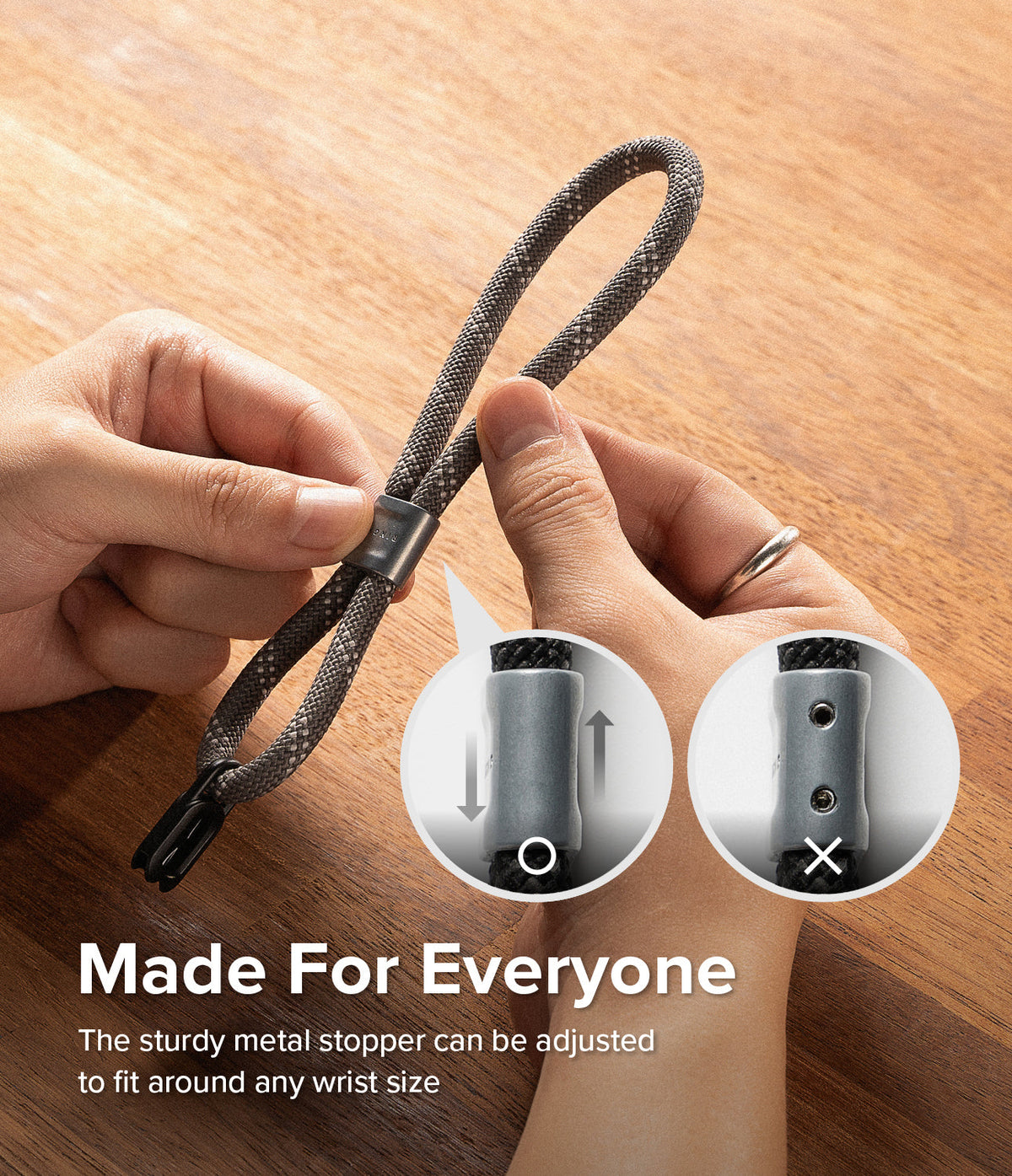 Rope Hand Strap - Hands adjusting a grey rope strap with a metal stopper, showing correct and incorrect alignment.