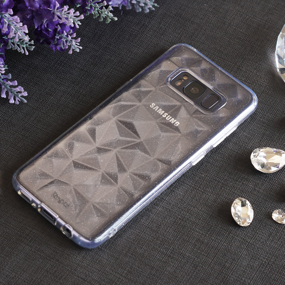 Galaxy S8 Case | Air Prism - Clear, glittery phone case with a geometric prism texture on a dark surface with floral accents.