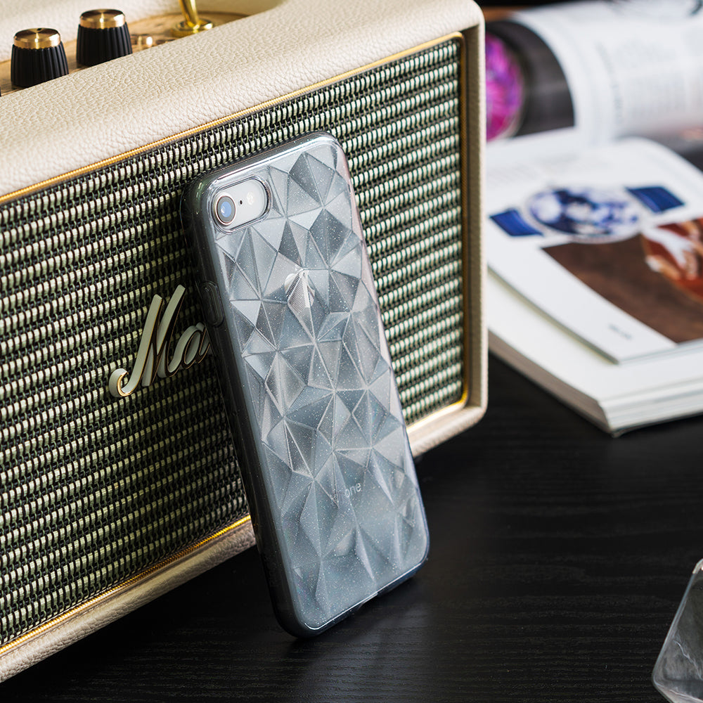 iPhone 8 / 7 Case | Air Prism - Translucent gray phone case with a geometric prism pattern leaning against a vintage-style speaker.