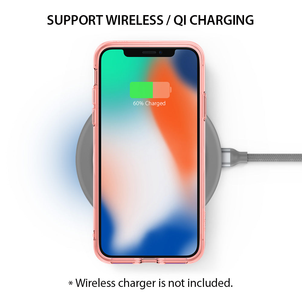 iPhone X Case | Fusion - Rose gold iPhone X in a clear case charging wirelessly on a grey Qi pad with a 60% battery icon.