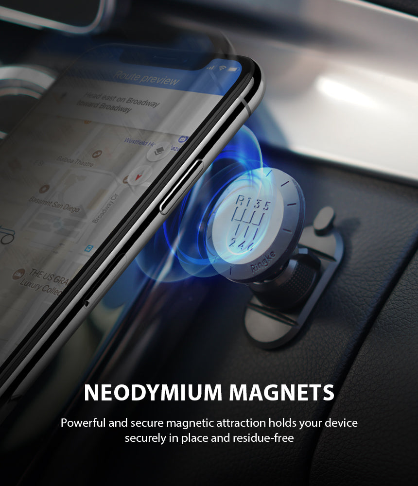 Magnetic Gear Car Mount - Smartphone attached to a gear-shift patterned magnetic mount on a car dashboard.