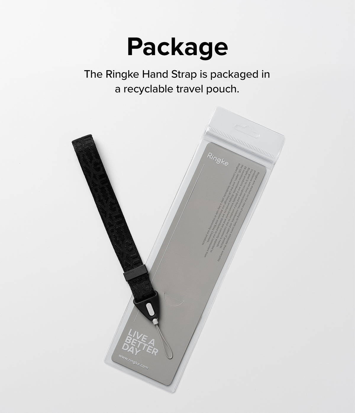 Hand Strap | Basic - A black fabric hand strap with a loop connector next to its branded, recyclable clear plastic packaging.