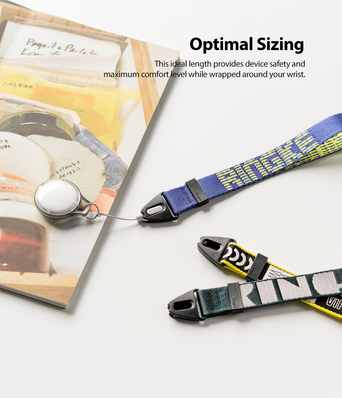 Hand Strap | Lettering - Three colorful patterned wrist straps with black plastic connectors laid on a white surface.