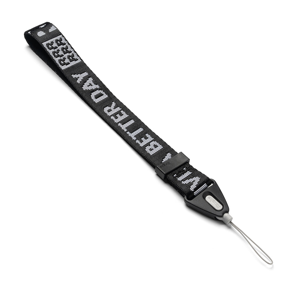 Hand Strap | Lettering - Black fabric wrist strap with white "BETTER DAY" text, black plastic buckle, and thin gray loop.