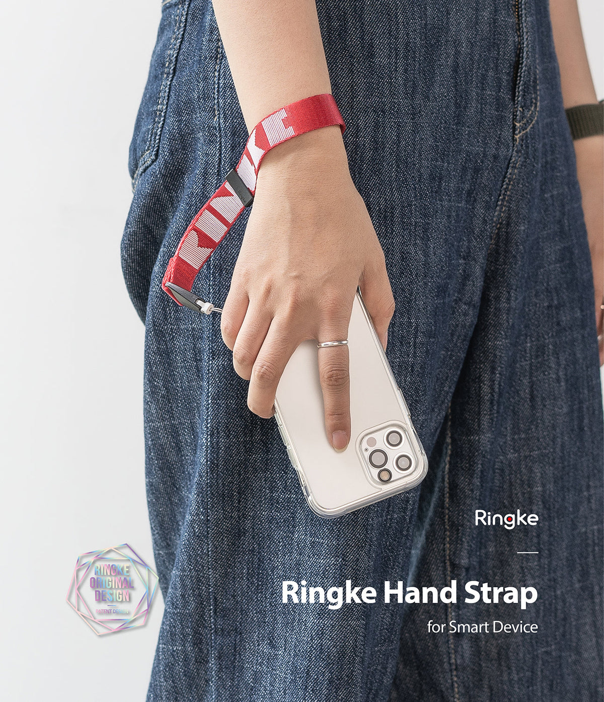 Hand Strap | Lettering - A person wearing a red Ringke branded fabric wrist strap attached to a smartphone in a clear case.