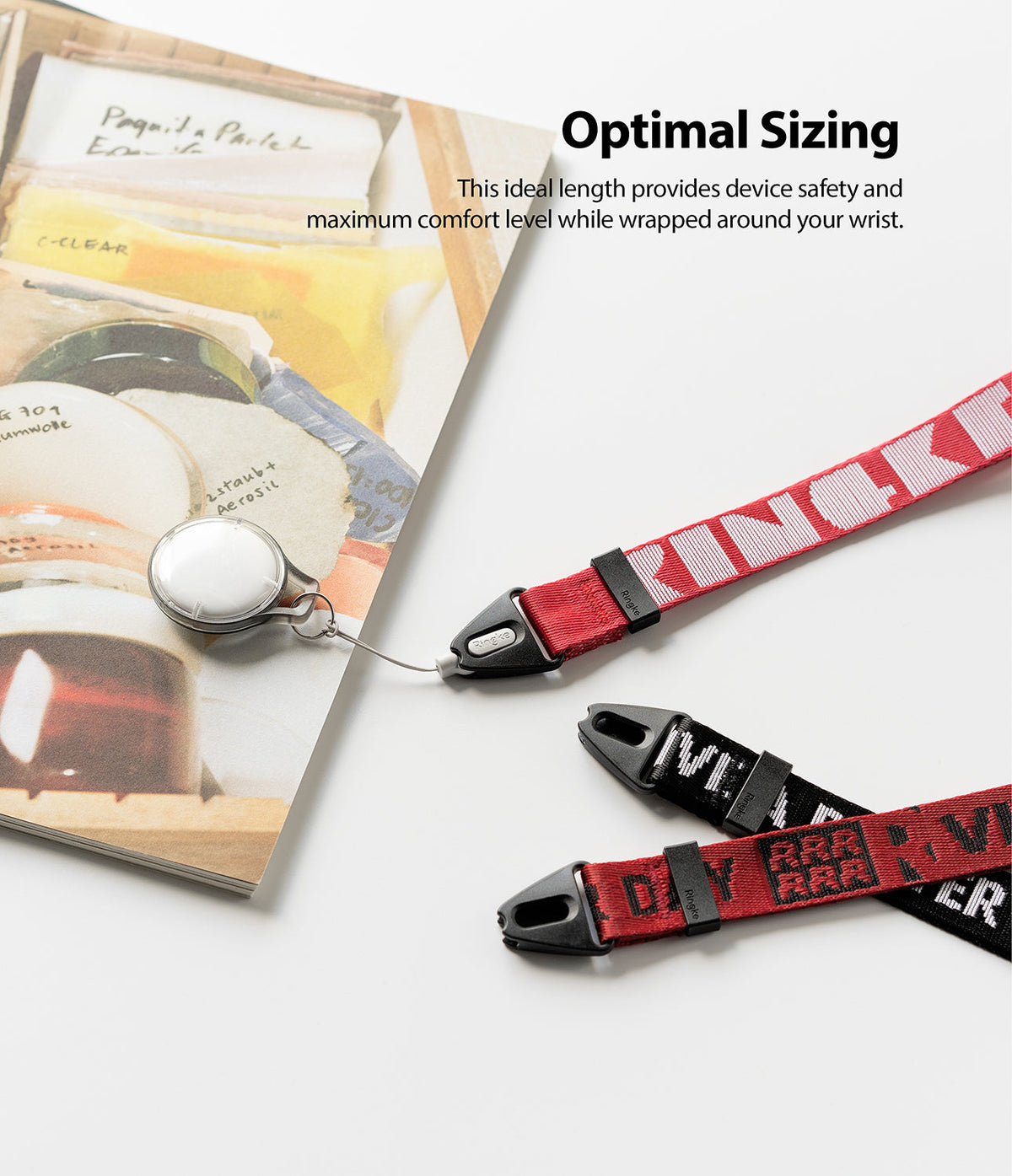 Hand Strap | Lettering - Red and black branded wrist straps with black plastic connectors on a white surface.