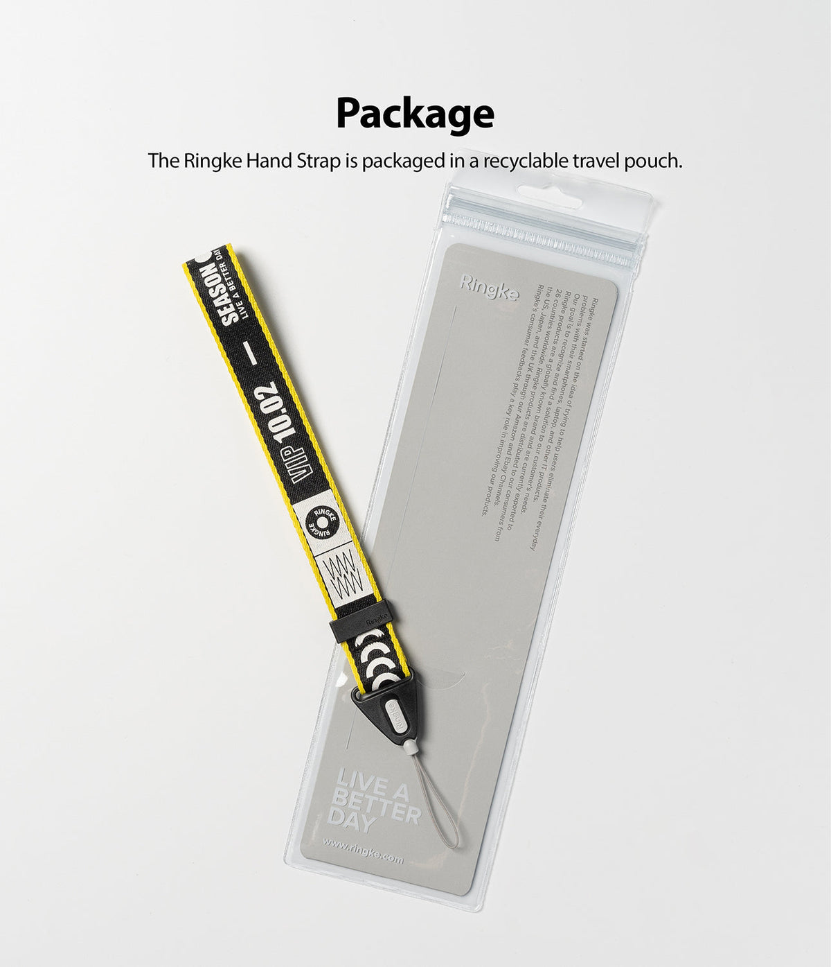 Hand Strap | Lettering - A black and yellow patterned hand strap resting on a clear, recyclable plastic product pouch.