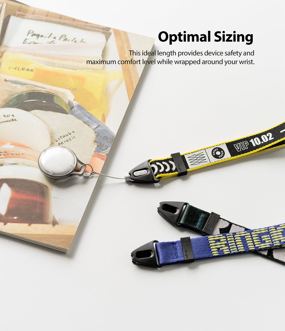 Hand Strap | Lettering - Two patterned wrist straps with black clips and lettering, one attached to a white circular tag.