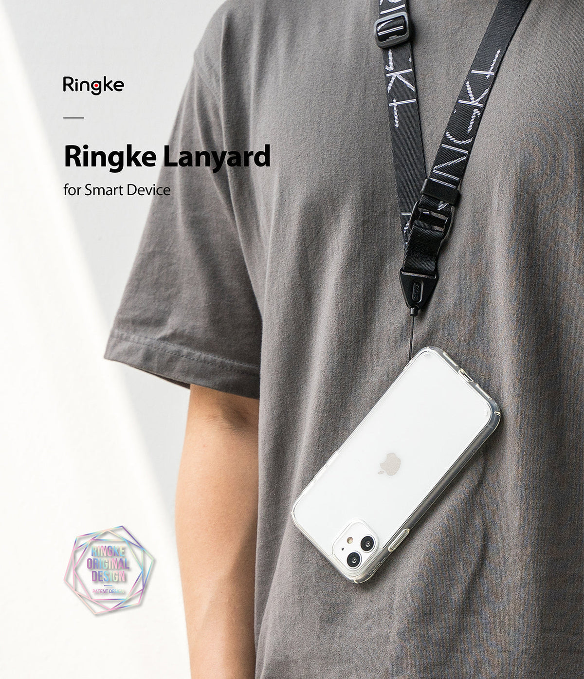 Design Lanyard Strap - Person wearing a black branded lanyard holding a clear smartphone case against a grey t-shirt.
