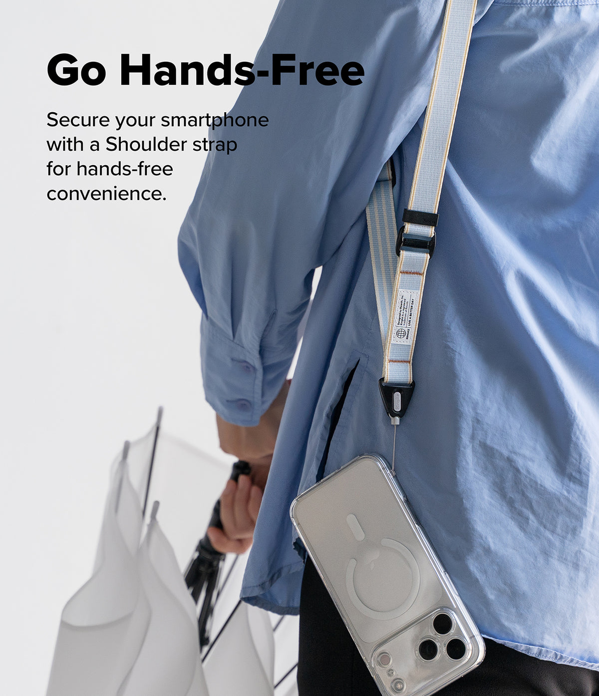 Design Lanyard Strap - A person in a blue shirt wears a light blue and white striped shoulder strap attached to a clear phone case.