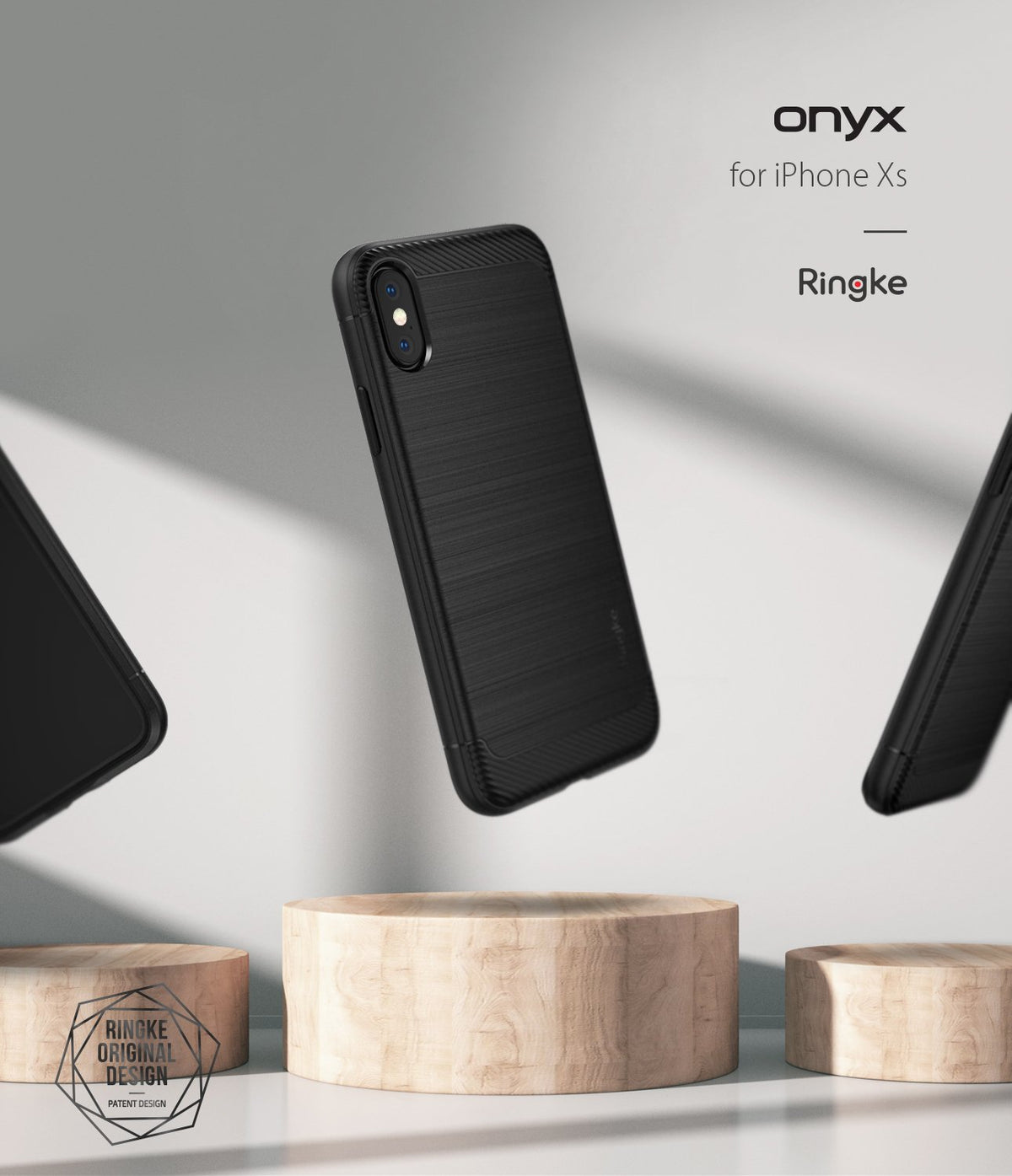 iPhone XS Case | Onyx - Black brushed-texture phone case floating above wooden pedestals against a minimalist gray background.