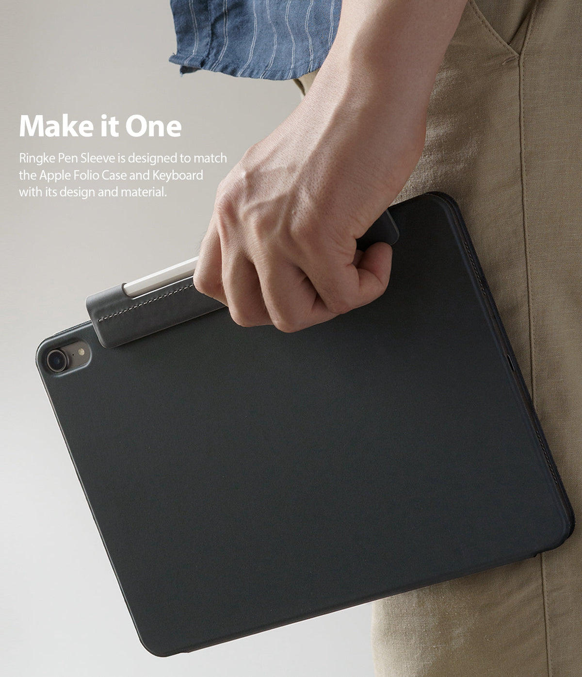 Pen Sleeve - A hand holds a black tablet folio case featuring a matching pen sleeve attached to the side.