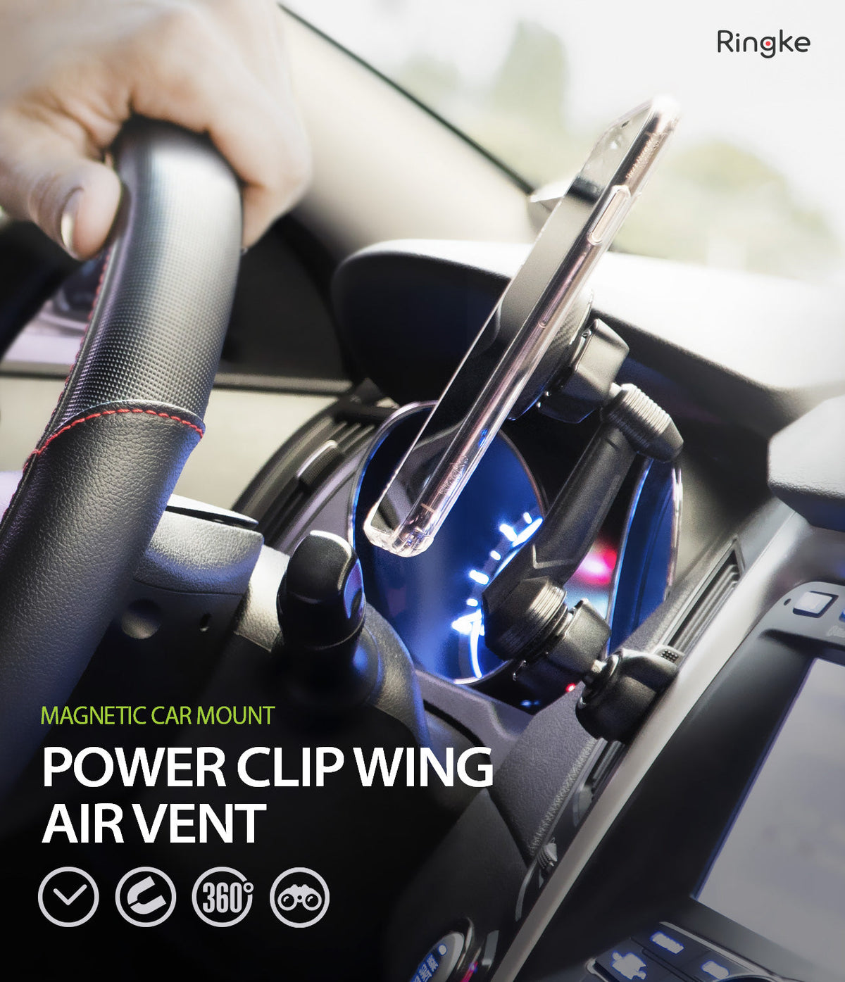 Power Clip Wing Car Mount - A smartphone mounted on a car air vent holder near the steering wheel.