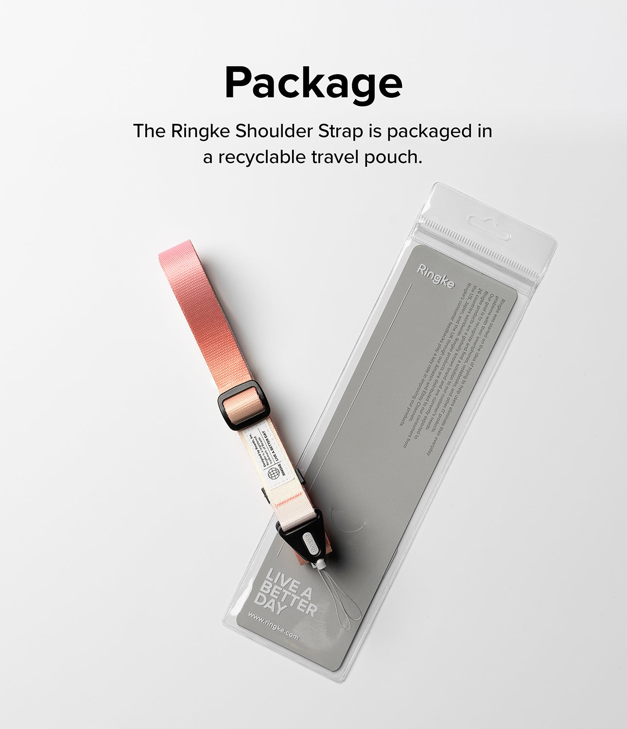 Design Shoulder Strap - A pink shoulder strap with black hardware resting on its recyclable, branded clear plastic packaging.