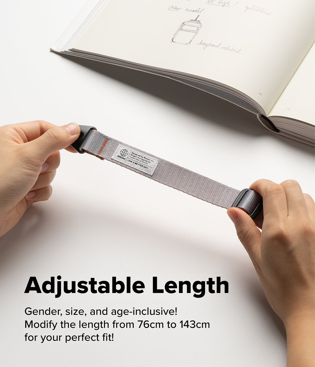 Design Shoulder Strap - Hands holding a grey adjustable fabric strap with a Ringke brand label against a white background.
