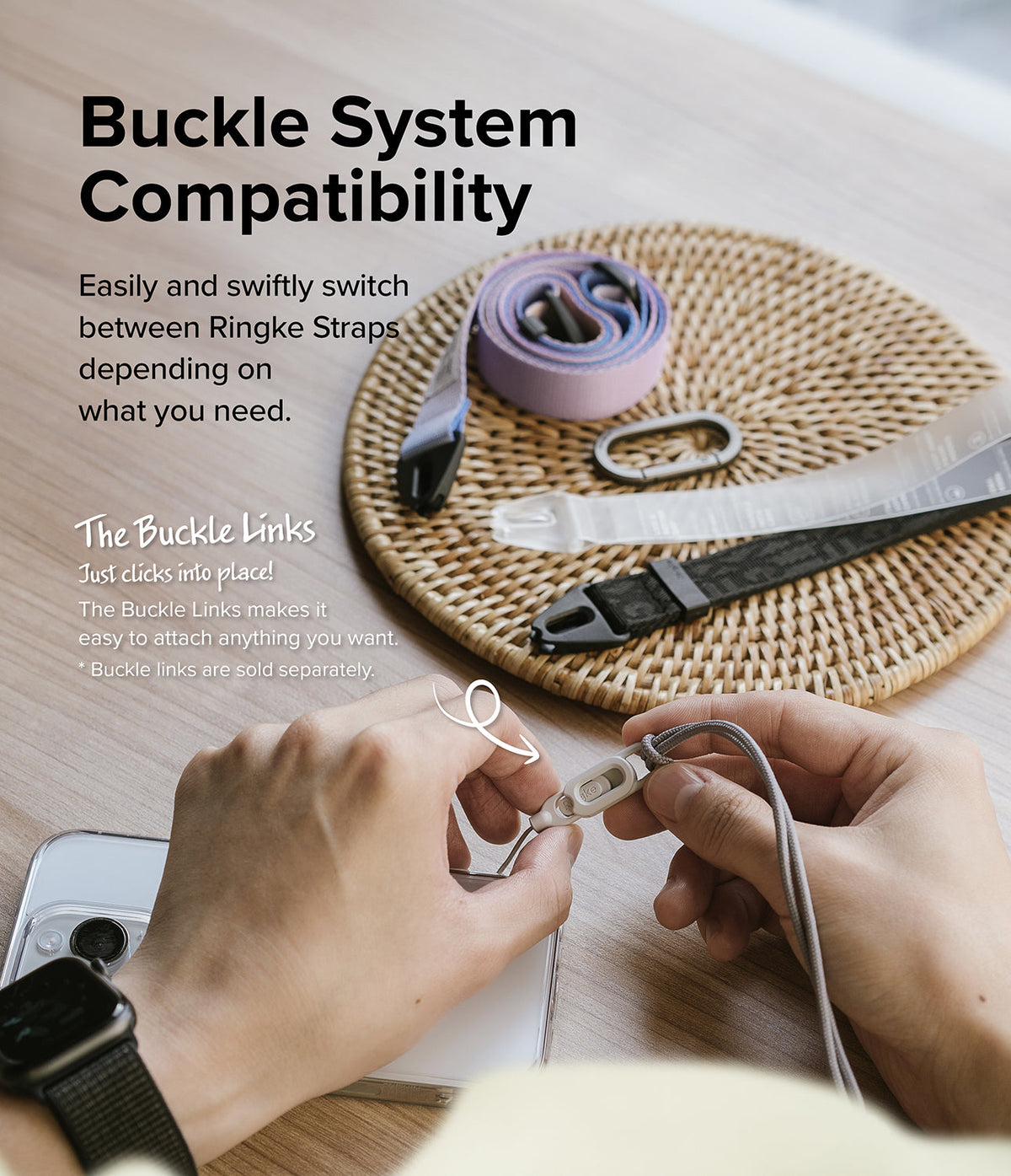 Design Shoulder Strap - Hands attaching a gray cord to a Ringke buckle link with various straps on a woven mat in the background.