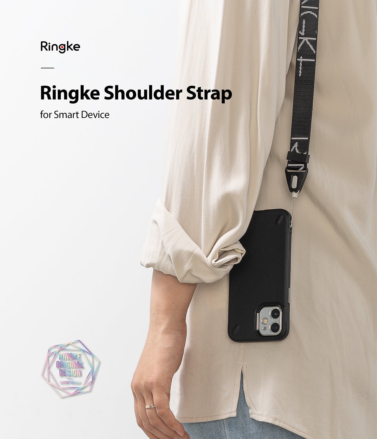 Design Shoulder Strap - Person wearing a black branded shoulder strap attached to a smartphone in a black case.