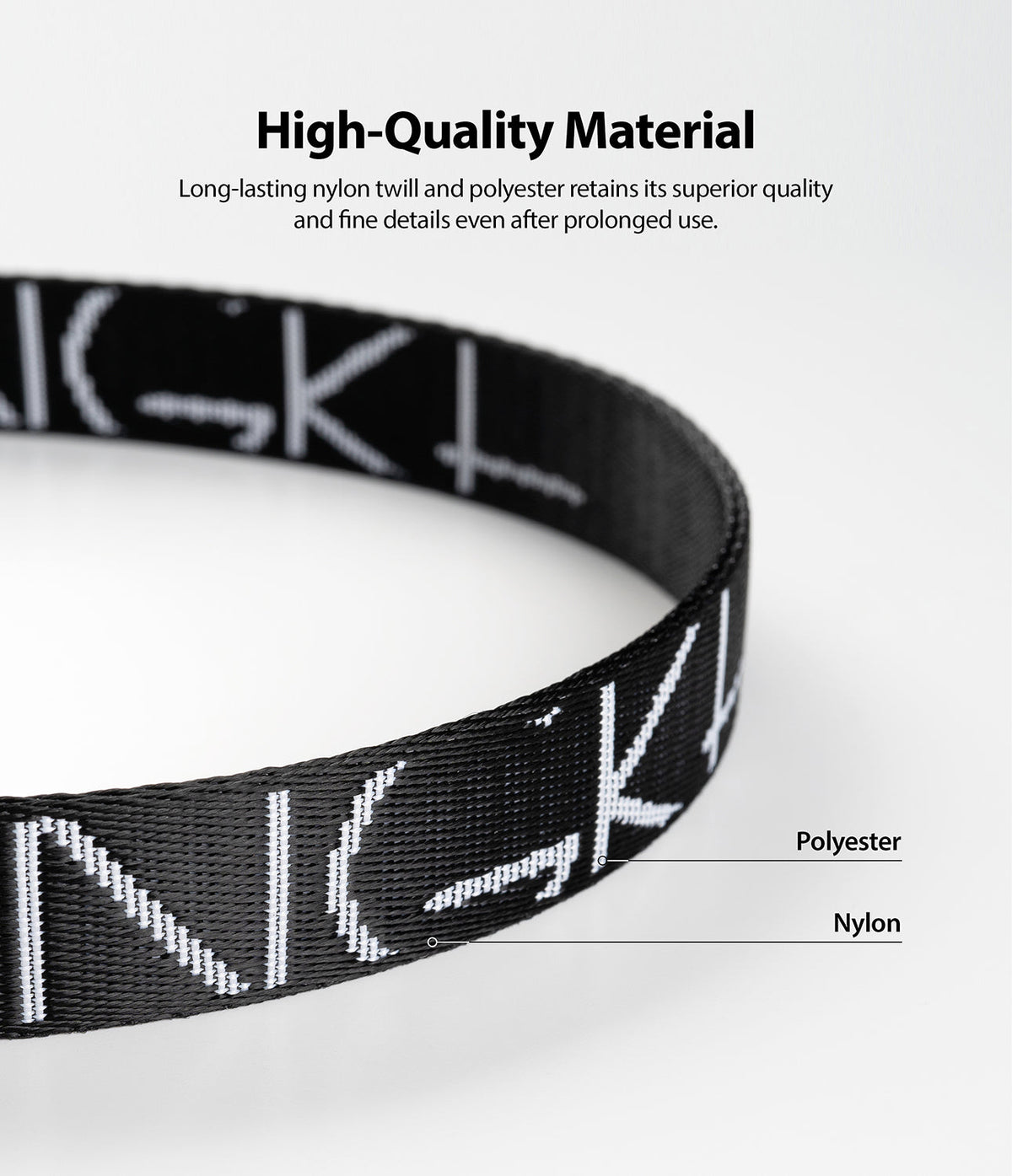 Design Shoulder Strap - Close-up of a black strap with white text, highlighting its durable nylon and polyester material.