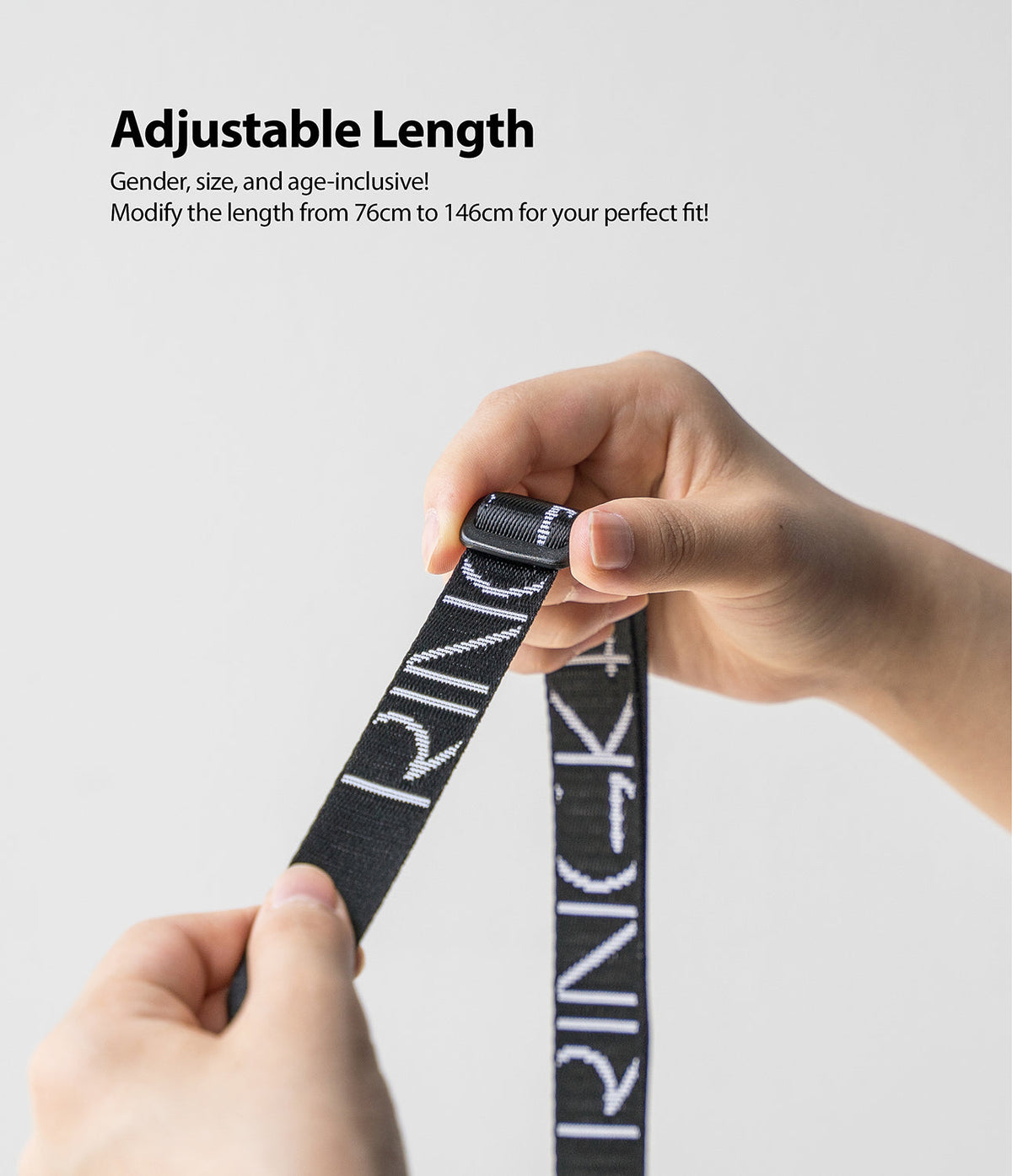Design Shoulder Strap - Hands adjusting the length of a black Ringke branded shoulder strap with a plastic slider.
