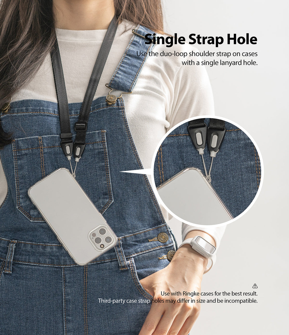 Shoulder Strap | Black / Neon Orange - Person wearing a phone on a black shoulder strap attached to a single lanyard hole.