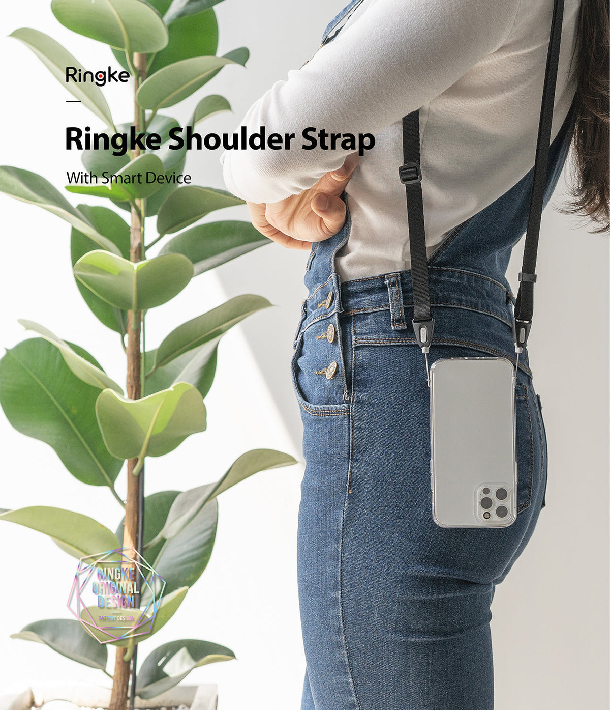 Shoulder Strap | Black / Neon Orange - Person wearing a black phone shoulder strap attached to a clear smartphone case.