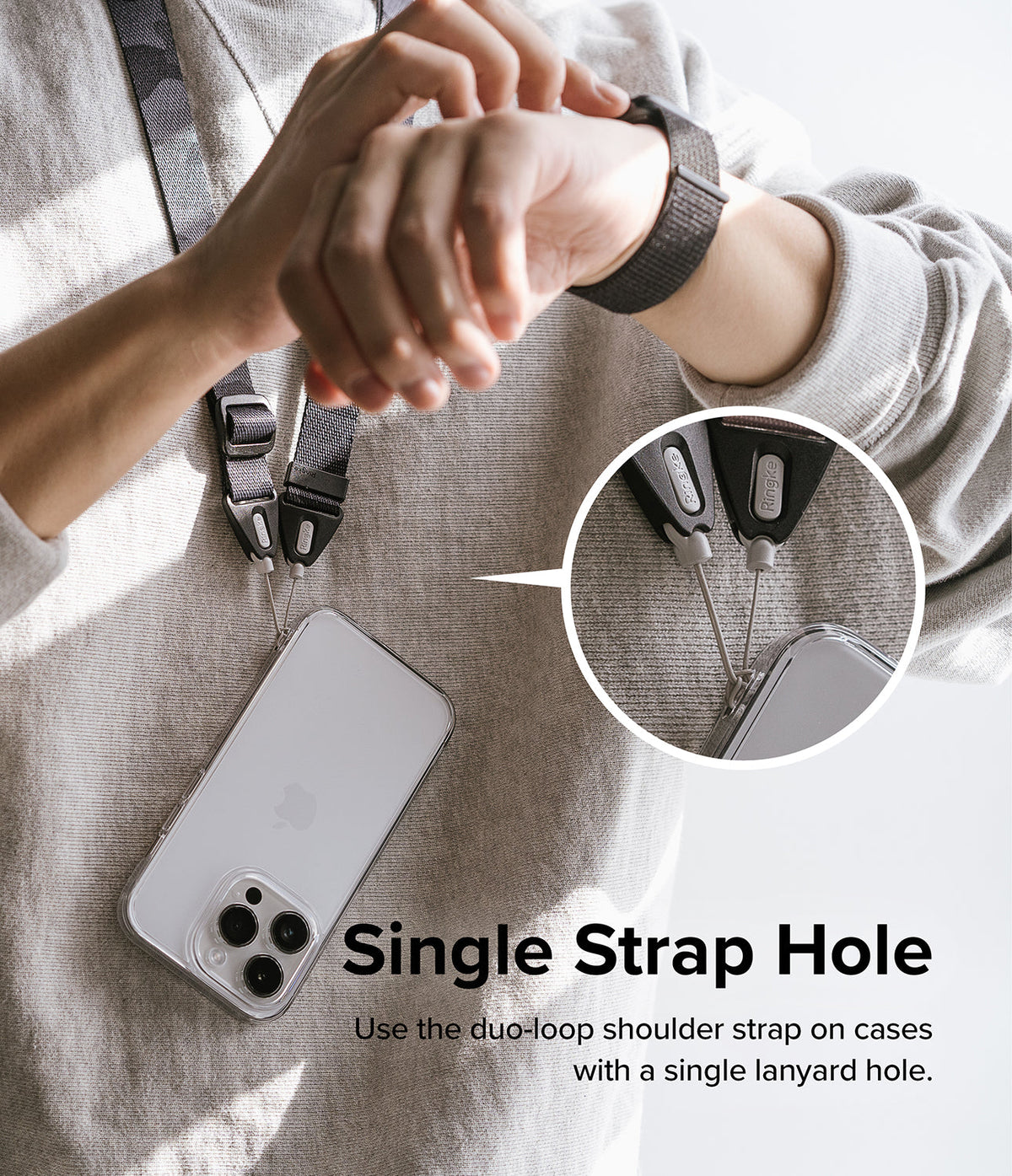 Design Shoulder Strap - A person wearing a phone on a duo-loop strap attached to a single lanyard hole on a clear phone case.
