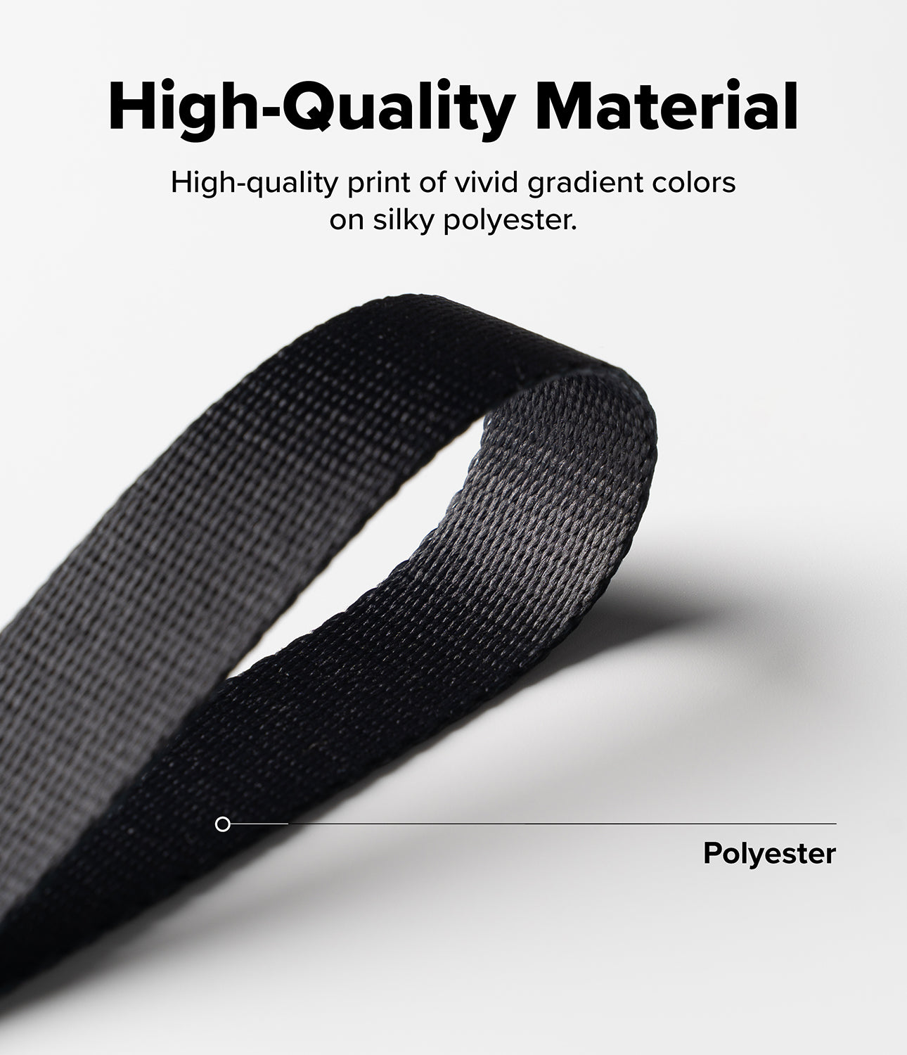 Design Shoulder Strap - Close-up of a black polyester strap with a label pointing to the material against a white background.