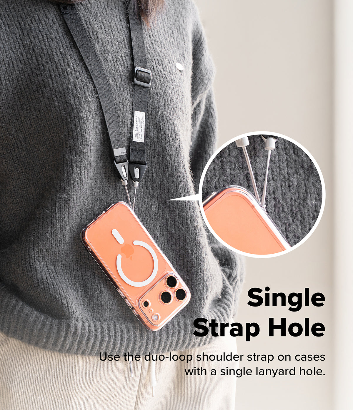 Design Shoulder Strap - A person wearing a black shoulder strap attached to a phone case with a single lanyard hole via a duo-loop.