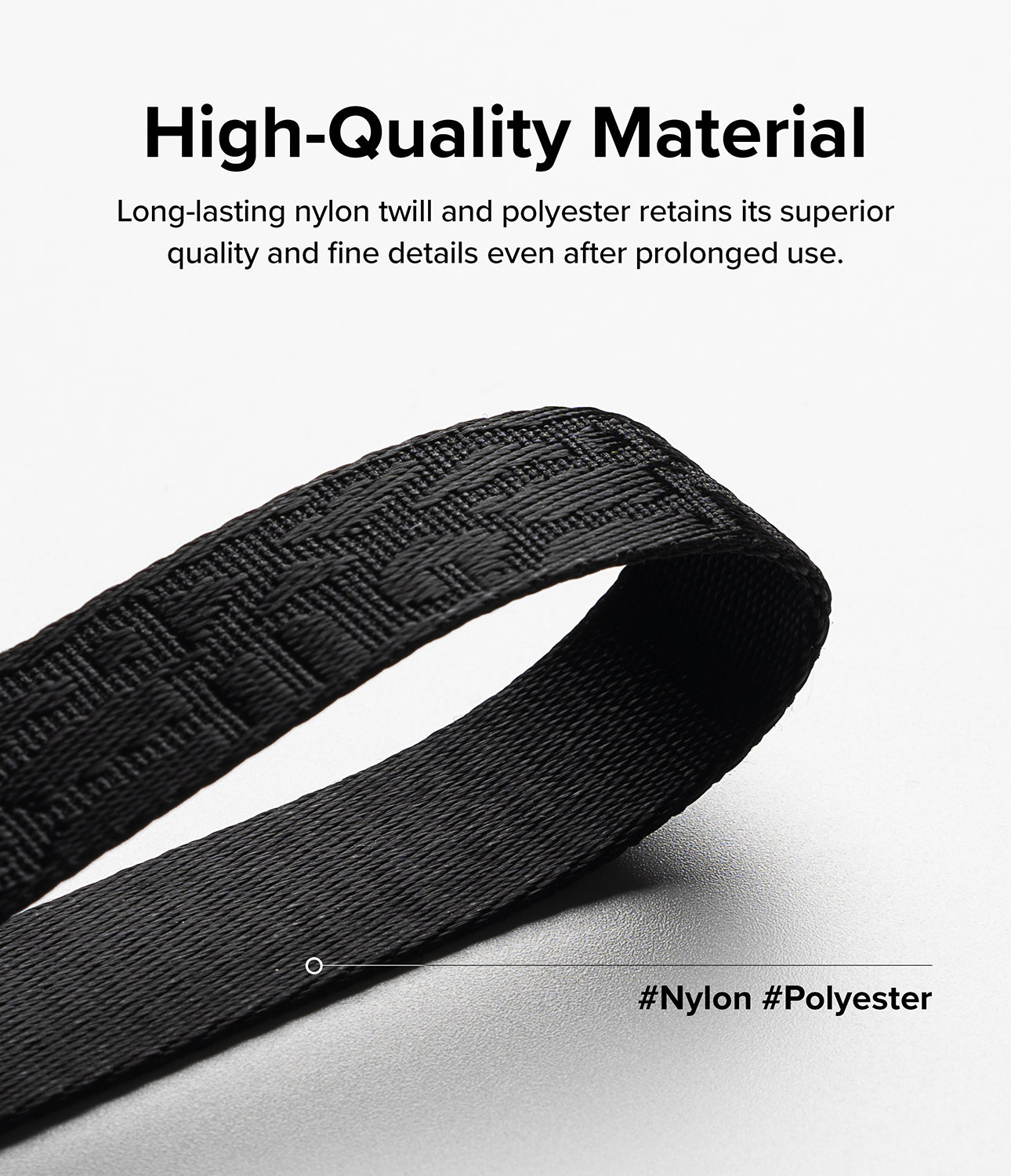Design Shoulder Strap - Close-up of a textured black nylon and polyester strap against a white background.