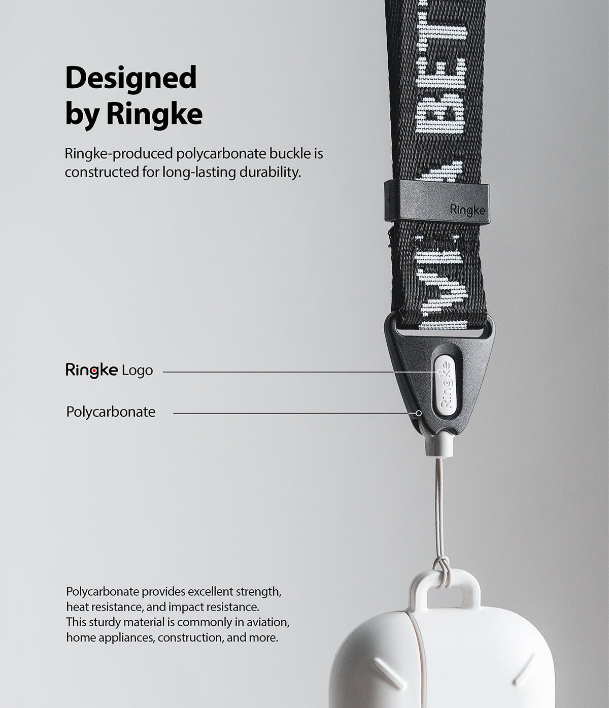 Shoulder Strap | Lettering - Close-up of a black branded shoulder strap with a durable polycarbonate buckle and logo.