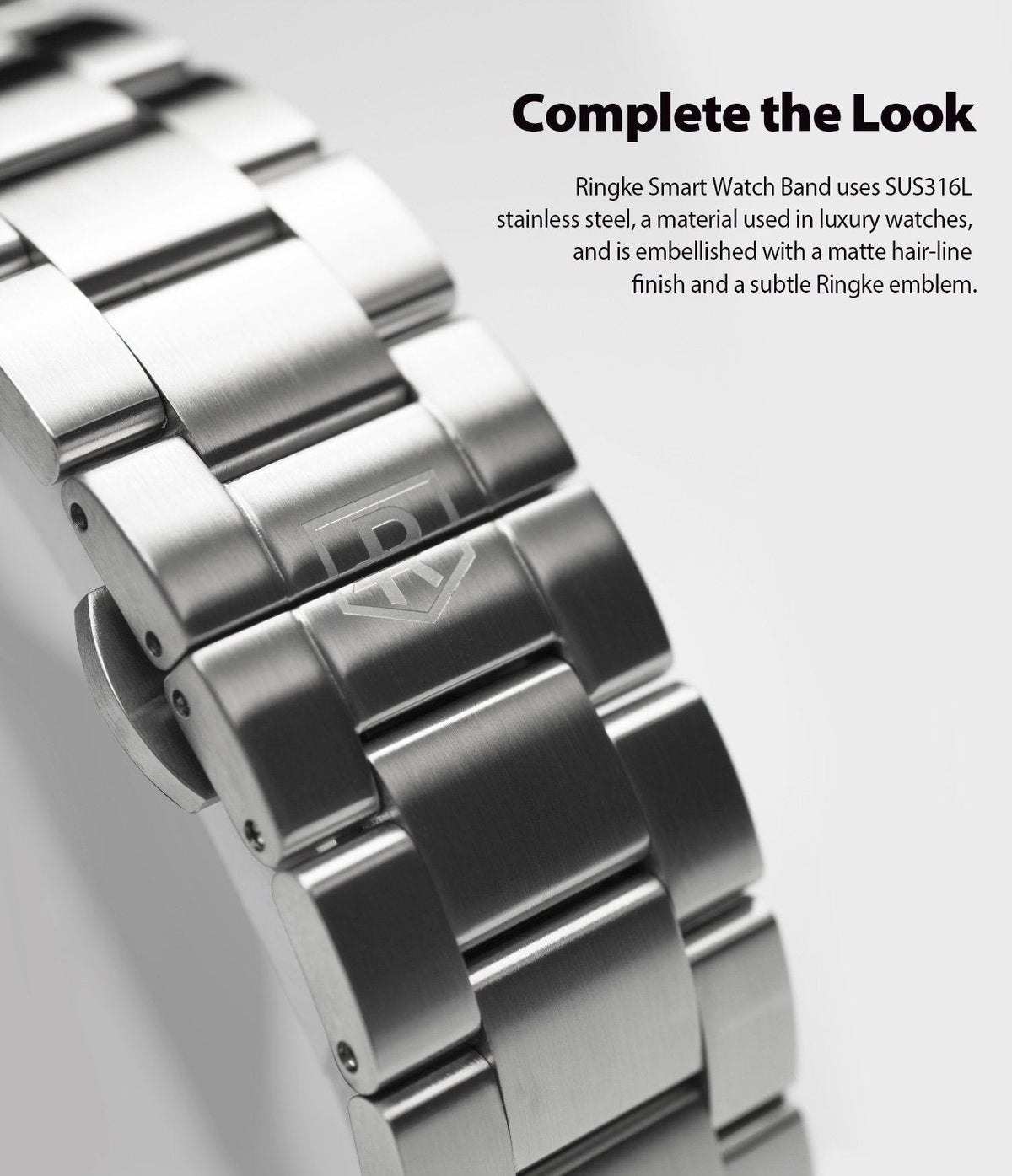 Galaxy Watch 46mm | Metal One Band - Close-up of a brushed stainless steel watch band featuring a subtle engraved logo.
