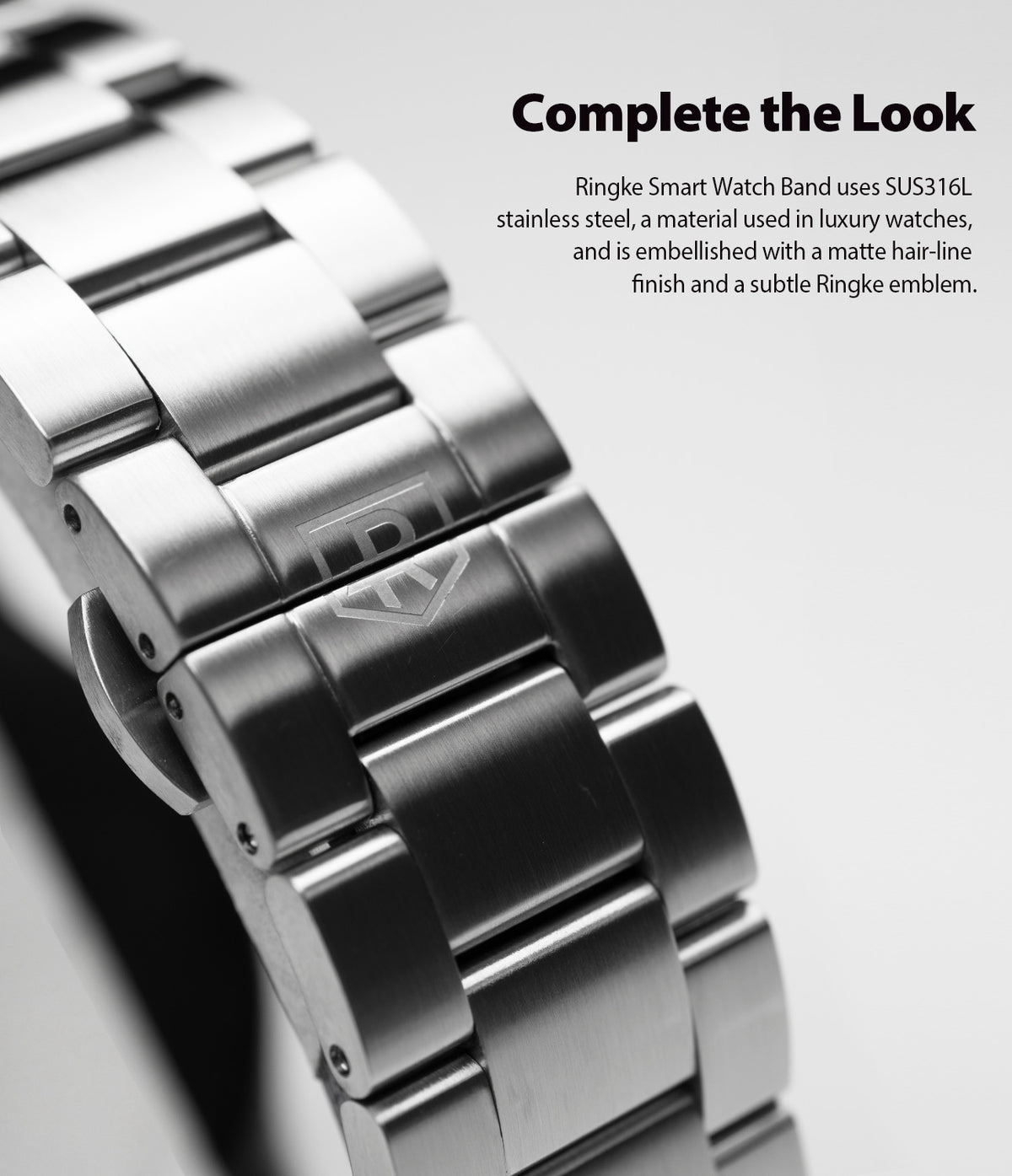 Galaxy Watch Active 2 44mm | Metal One Band - Close-up of a brushed stainless steel watch band with a subtle logo.