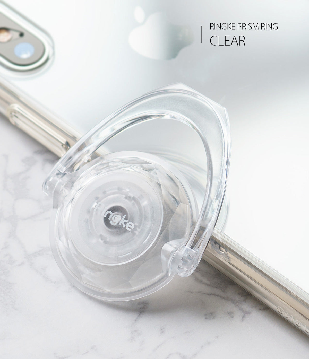 Prism Ring - A clear, faceted circular phone ring holder with a rotating loop attached to the back of a smartphone.