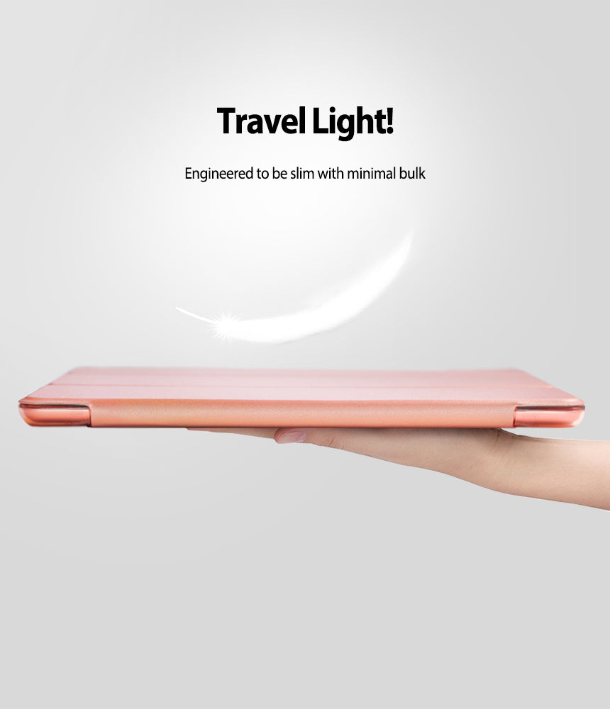 Smart Cover Clear Slim Stand | iPad - Smart Cover Clear Slim Stand - A hand holds a slim, rose gold iPad case under a floating white feather against a light background.