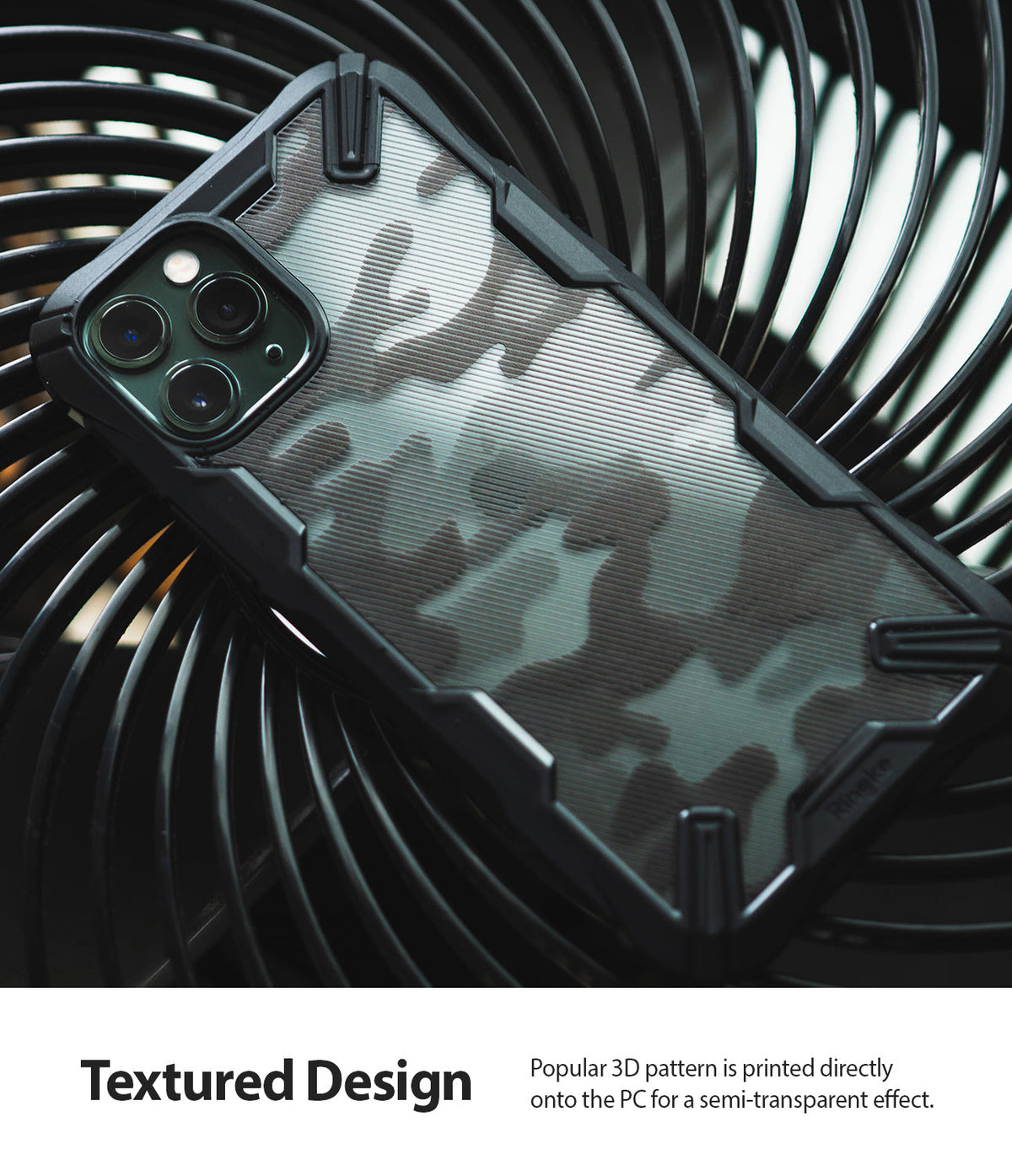 iPhone 11 Pro Max Case | Fusion-X Design - Black camouflage phone case with a textured, semi-transparent back on a fan.