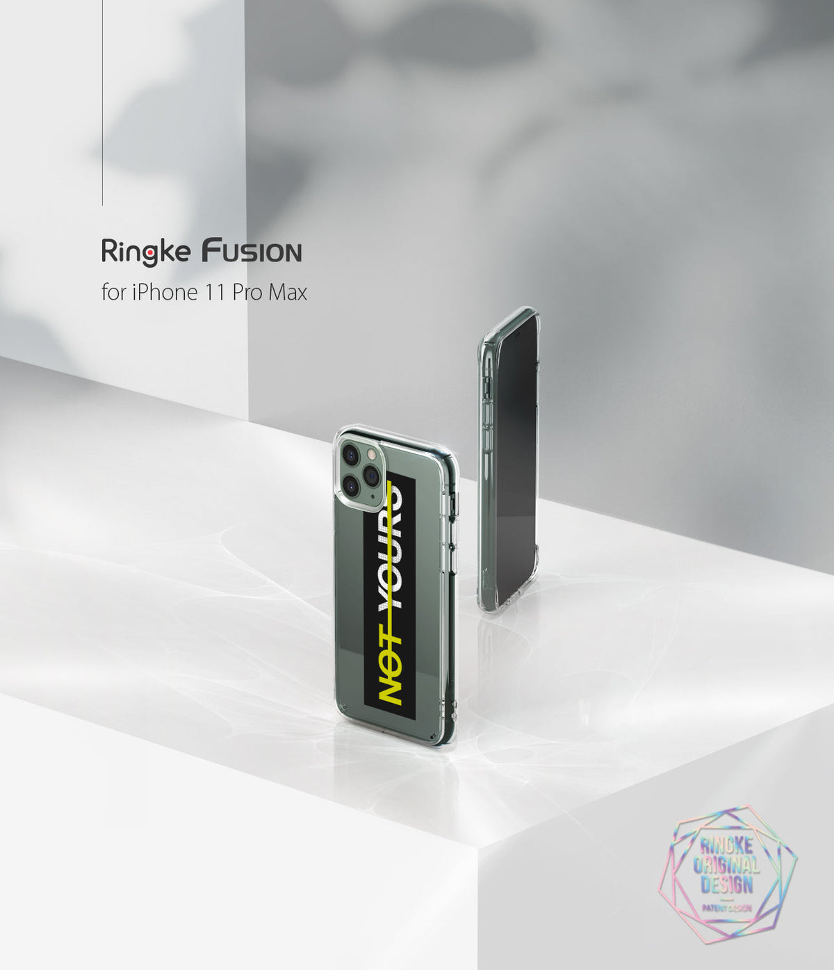 iPhone 11 Pro Max Case | Fusion Design - Two clear phone cases on a white surface, one showing a black insert with yellow text.