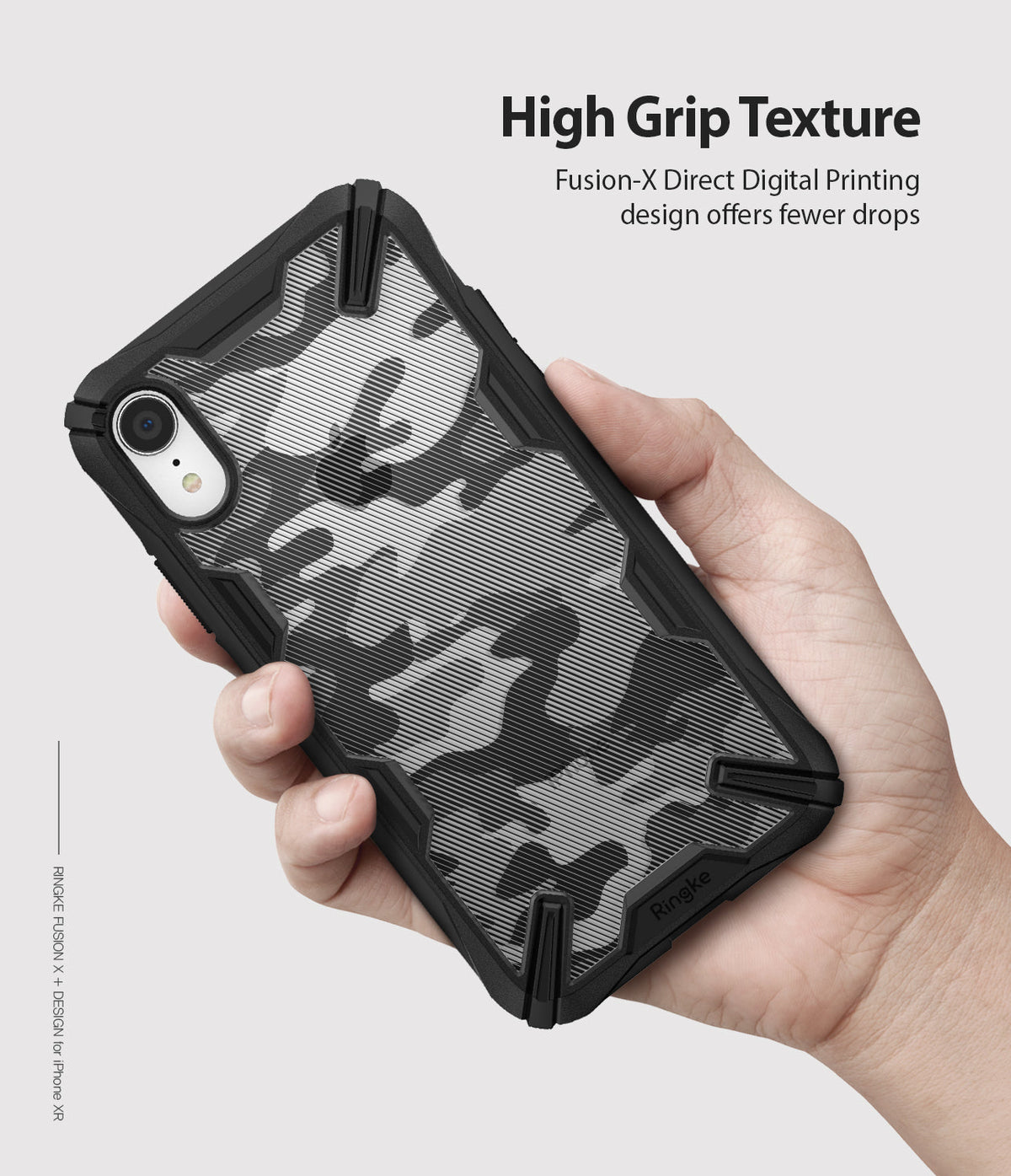 iPhone XR Case | Fusion-X - Hand holding a black camo-patterned phone case with a rugged, textured frame.