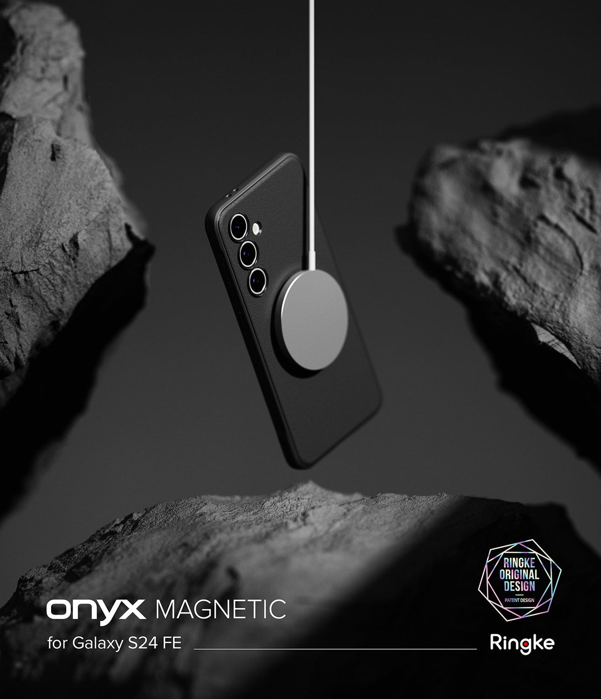 Galaxy S24 FE Case | Onyx Magnetic - Black phone case suspended by a magnetic charger between dark, textured rocks.