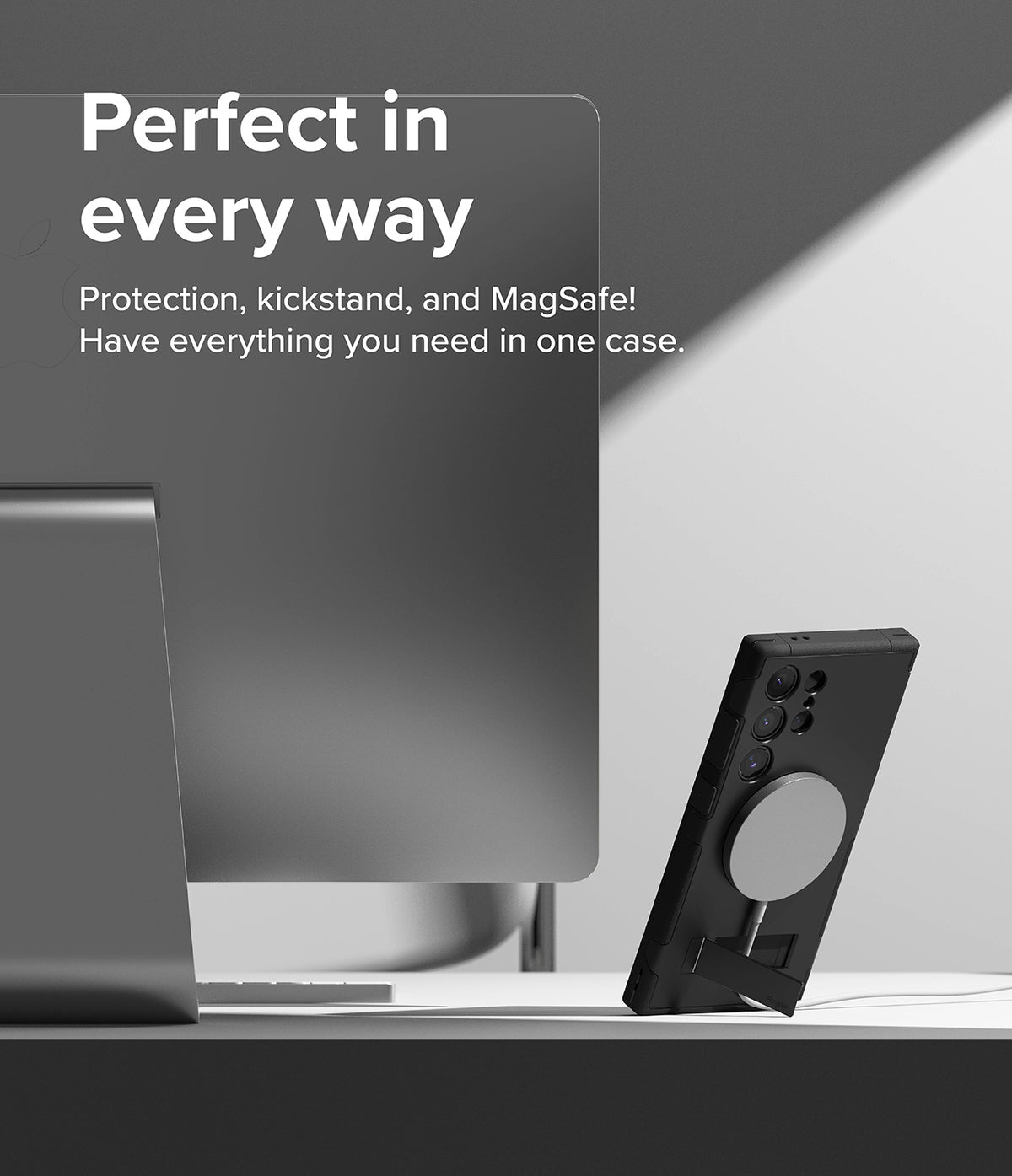 Galaxy S24 Ultra Case | Alles - Black phone case with MagSafe ring and kickstand on a desk next to a computer monitor.